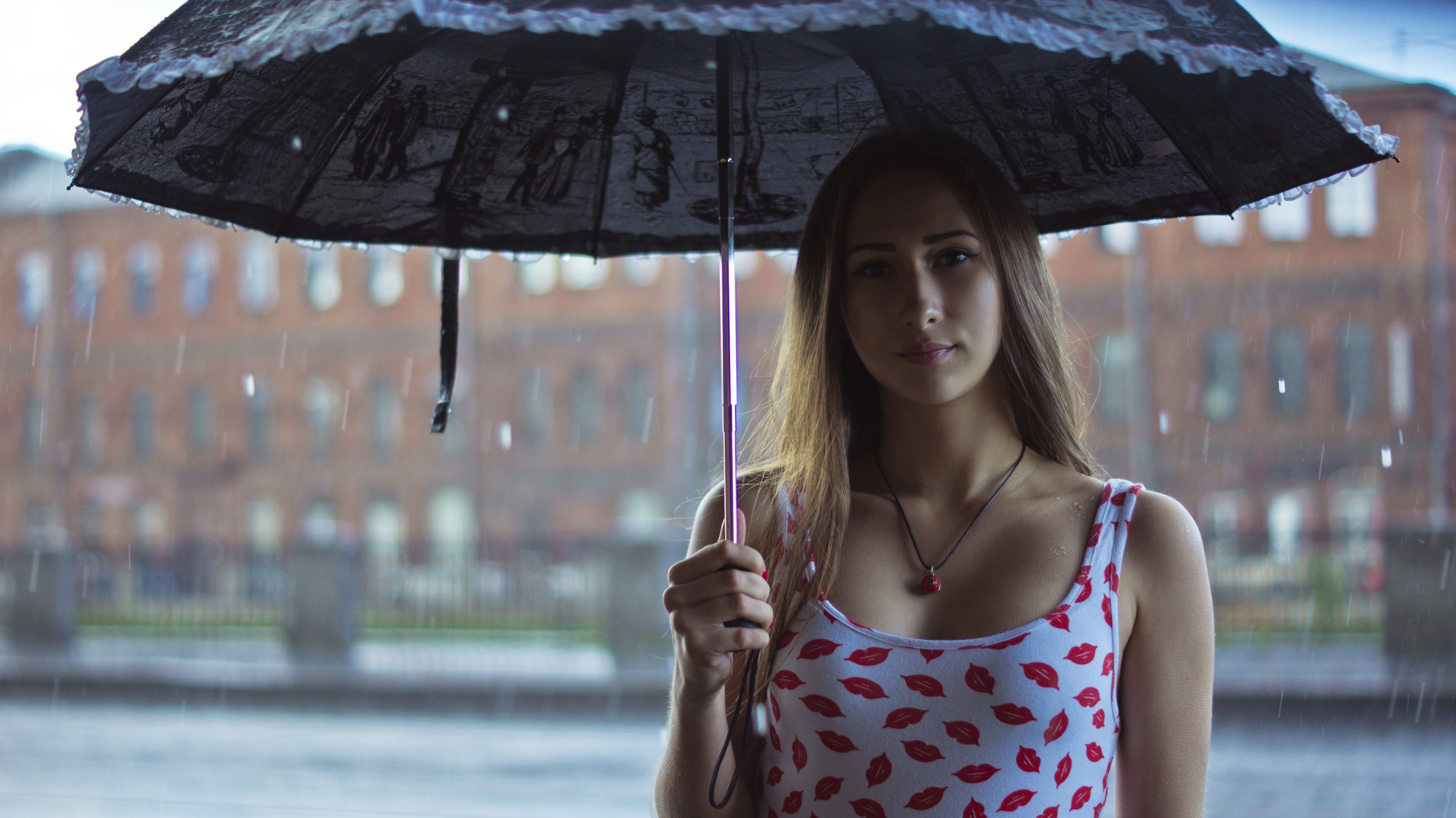 Woman holding an umbrella in the rain HD Wallpaper