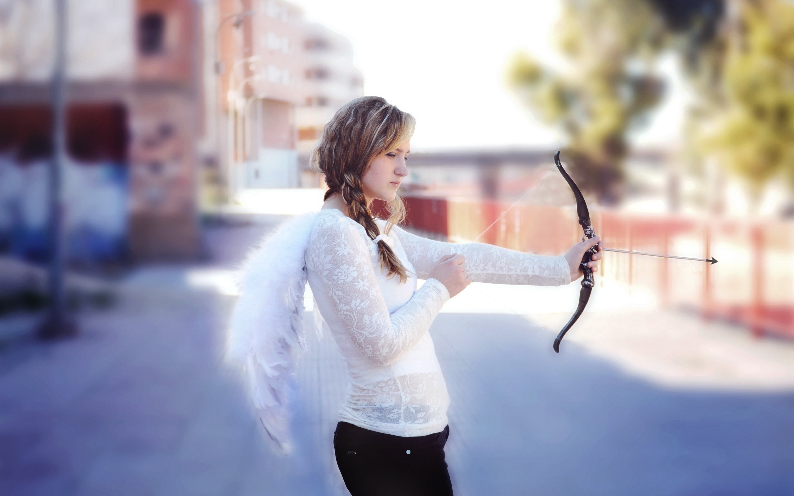 Woman dressed as Cupid with bow and arrow HD Wallpaper