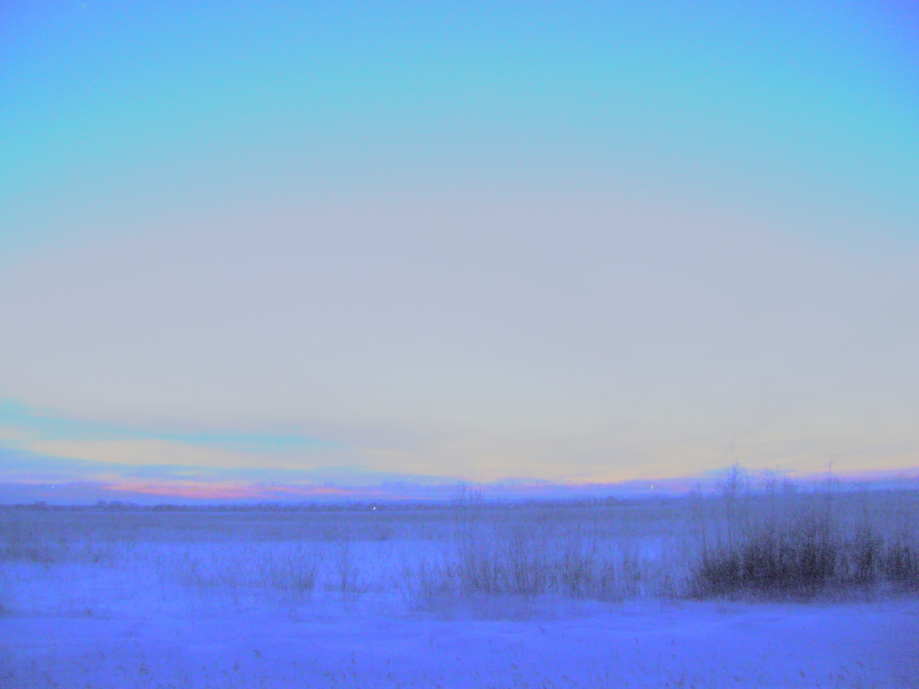 Snowy plain at dusk with colorful sky HD Wallpaper