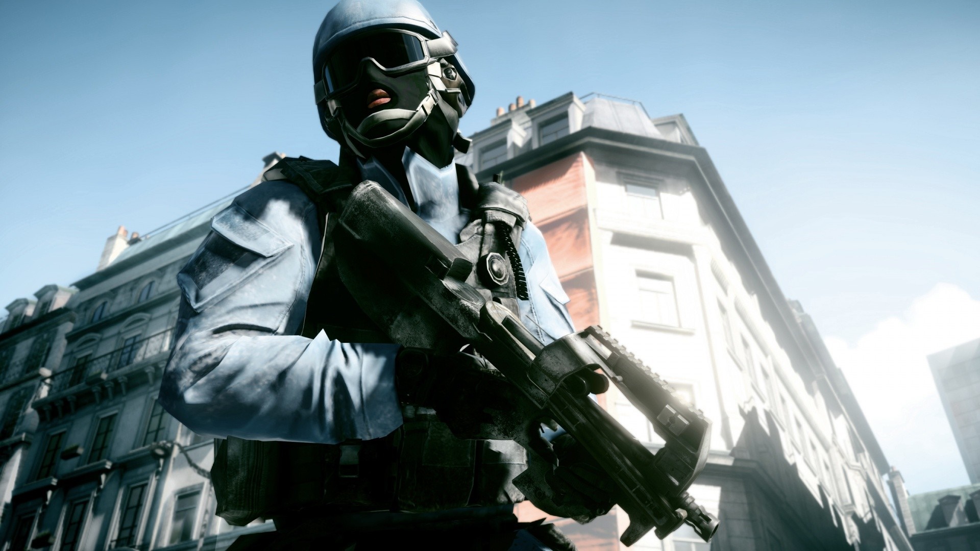Soldier with rifle in front of buildings HD Wallpaper