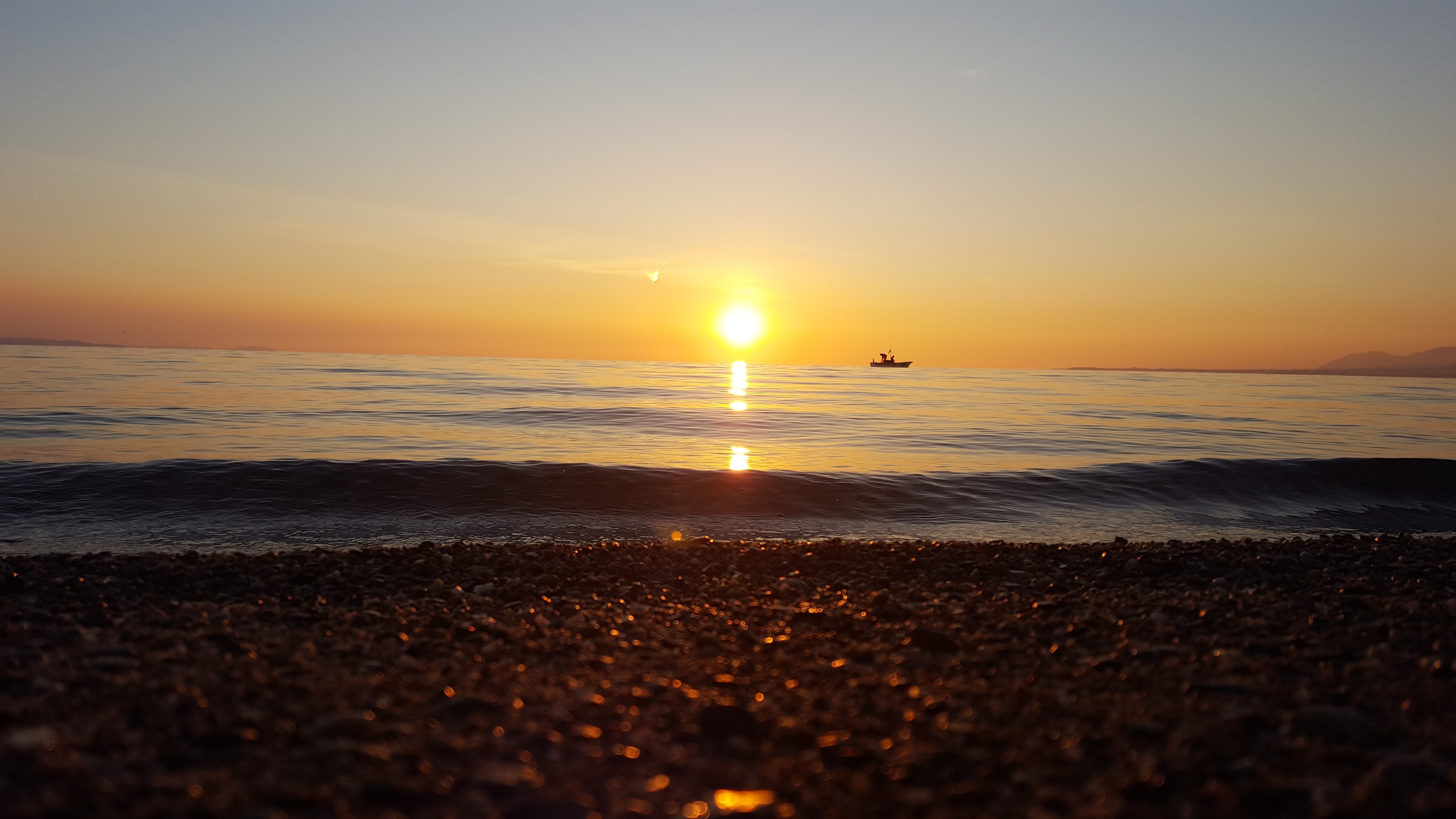 Sunset over the sea with a kayak HD Wallpaper