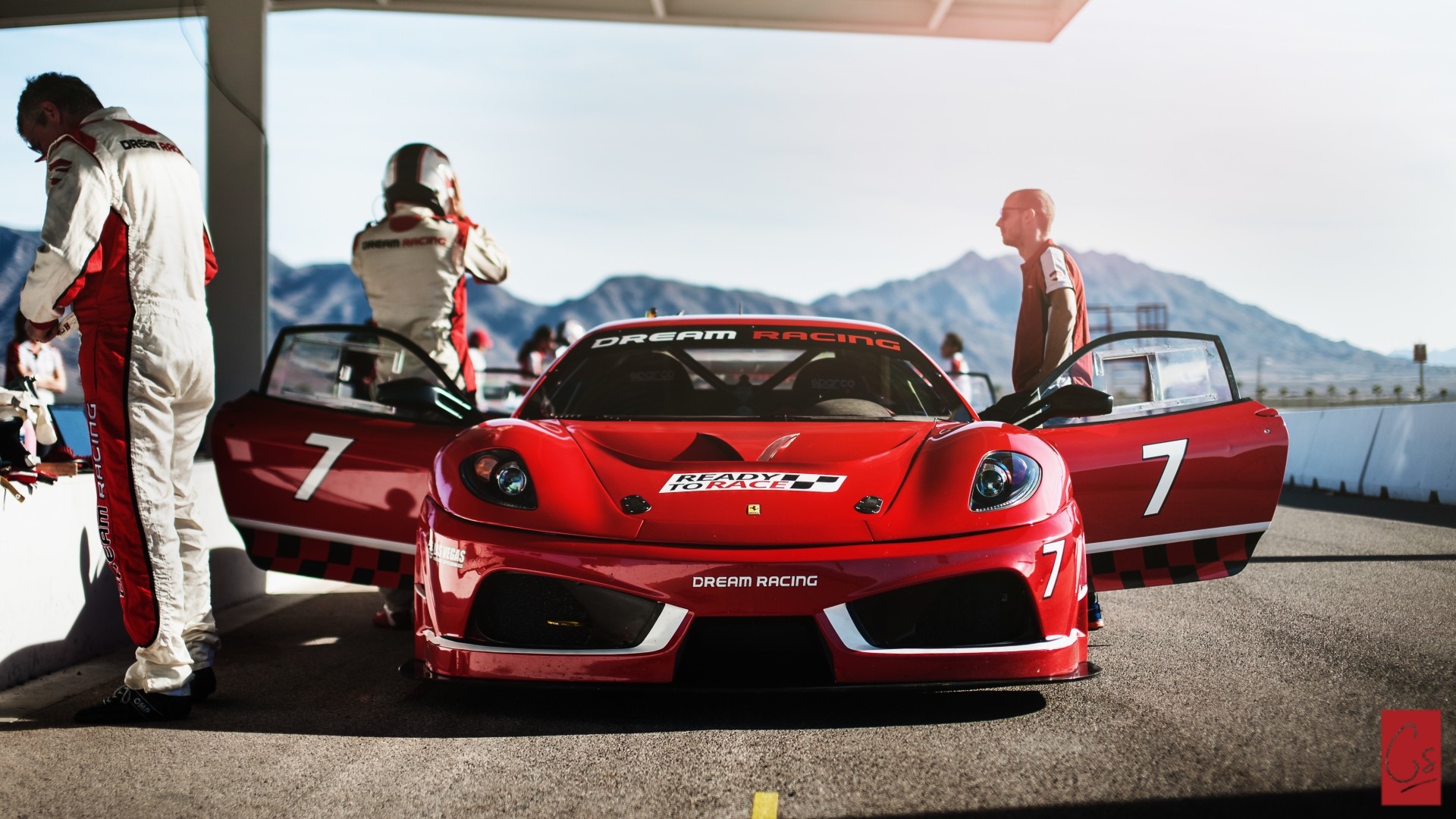 Ferrari race car with drivers at Dream Racing HD Wallpaper