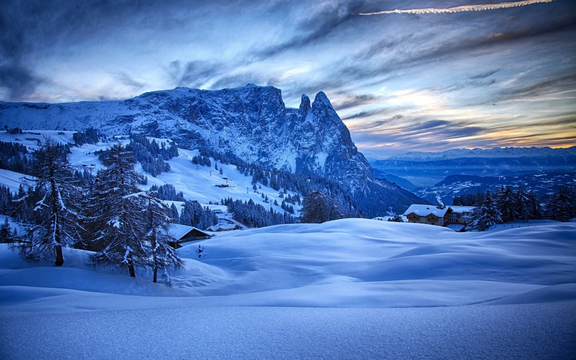 Snowy mountain landscape with houses and trees HD Wallpaper