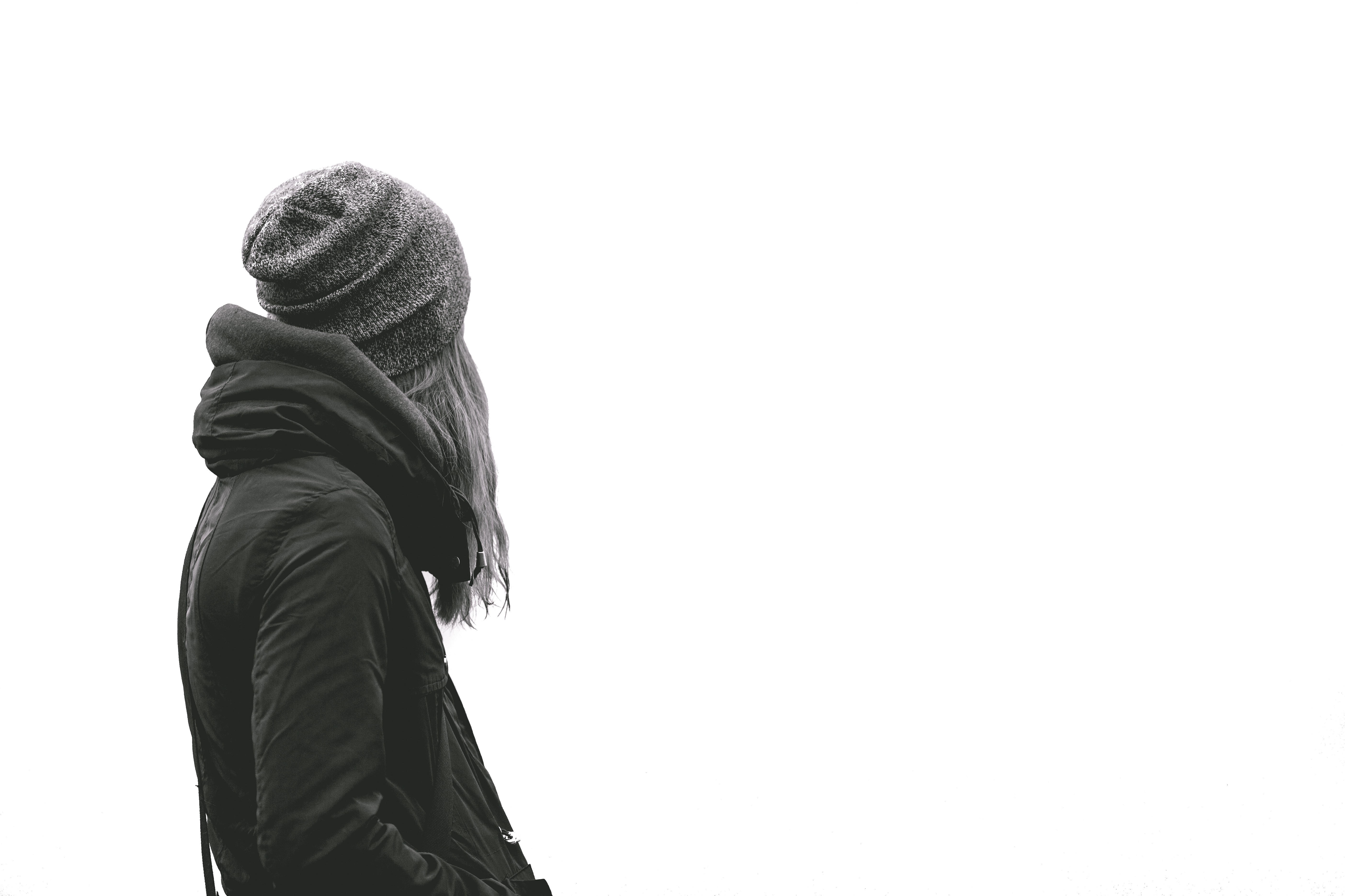 Woman wearing a beanie and jacket outdoors HD Wallpaper