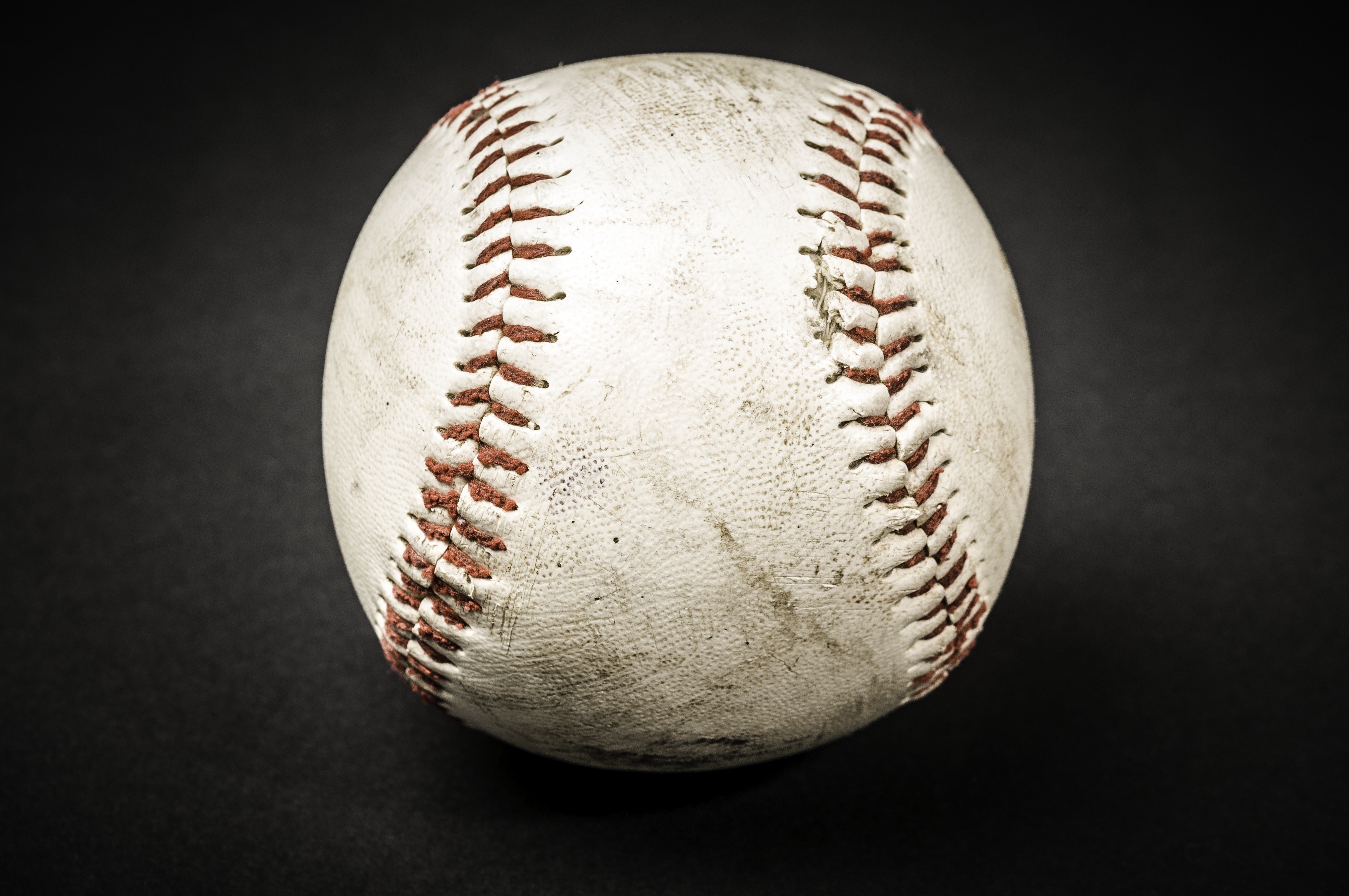 Close up of a worn baseball HD Wallpaper