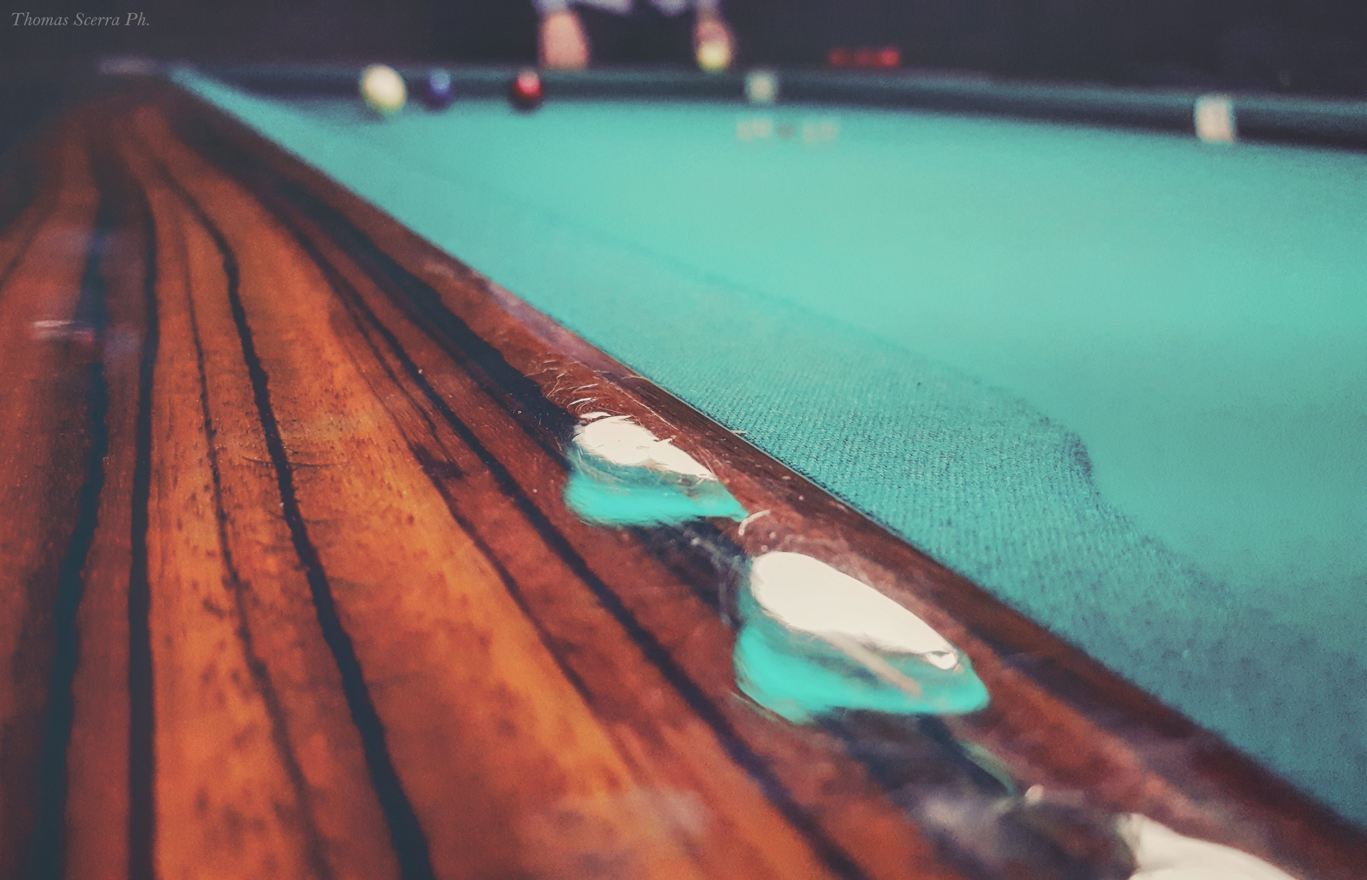 Close-up of a billiard table with balls in the background HD Wallpaper