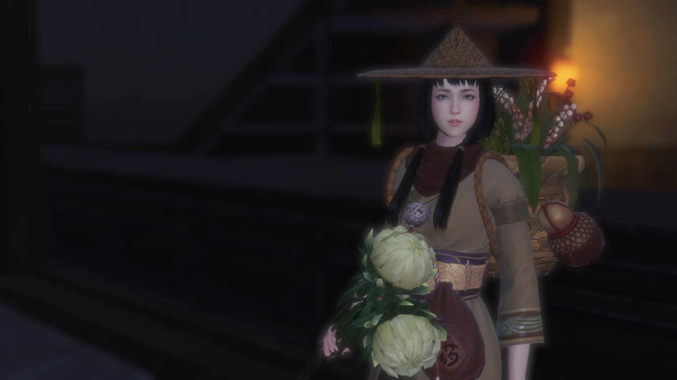 A woman in a conical hat holding flowers HD Wallpaper