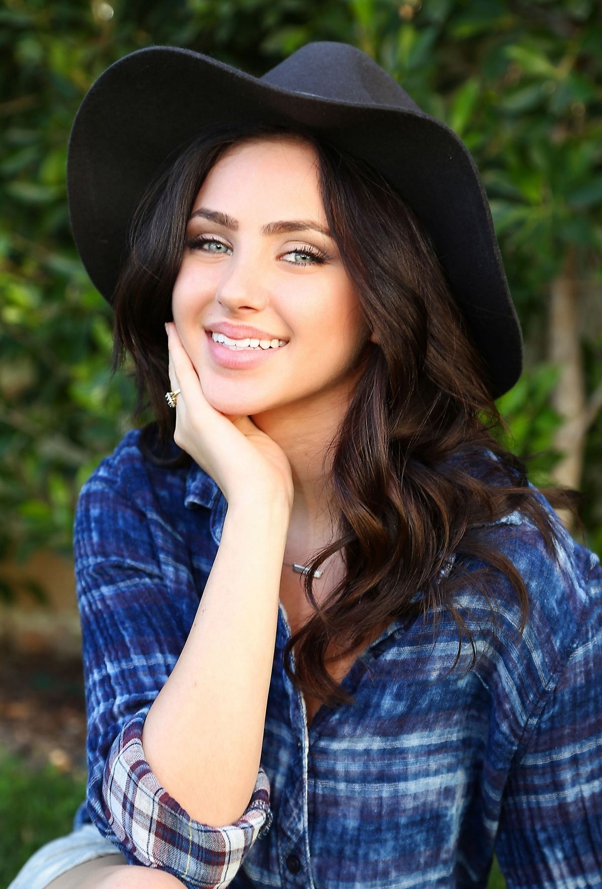 Woman with long brown hair wearing a hat and plaid shirt HD Wallpaper