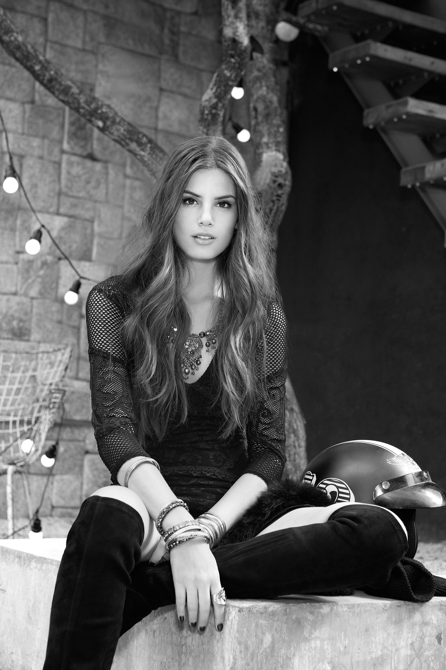 Camila Queiroz wearing a black dress and knee-high boots HD Wallpaper