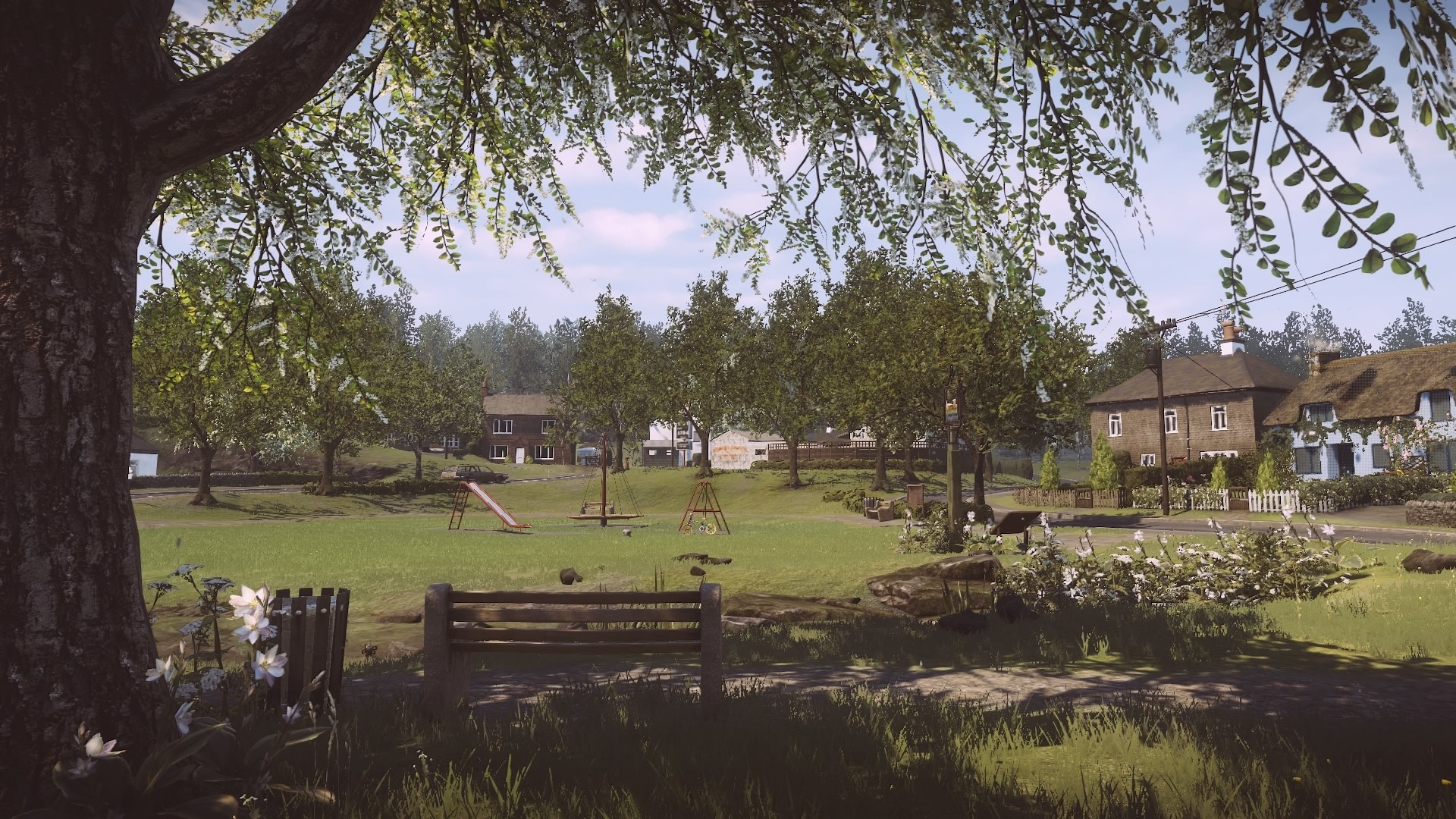 Playground in a rural village with houses and trees HD Wallpaper