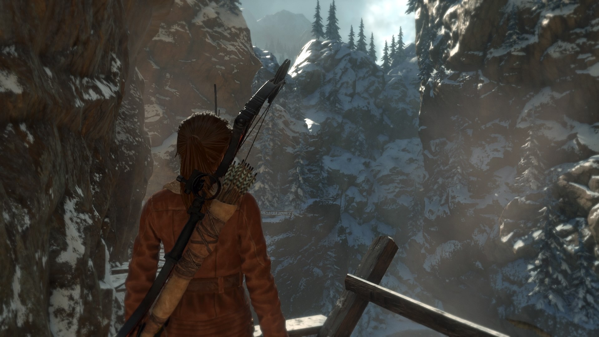 Lara Croft from Tomb Raider in a snowy mountain landscape HD Wallpaper
