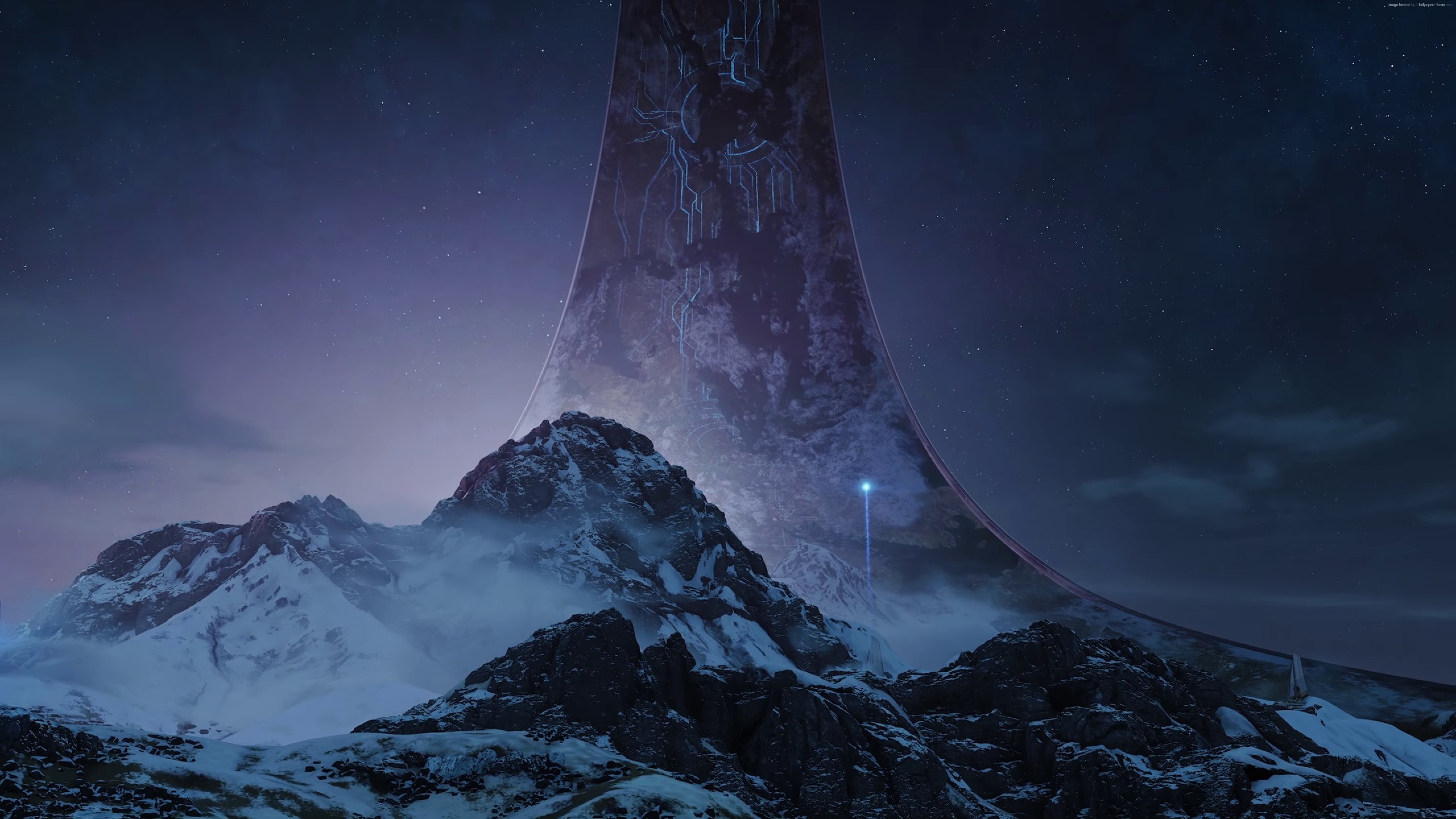 Halo Infinite ring structure over snowy mountains HD Wallpaper