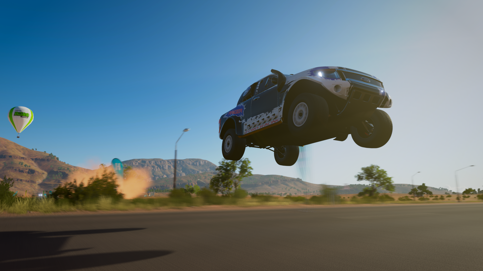 Off-road vehicle performing a jump in Forza Horizon 3 HD Wallpaper