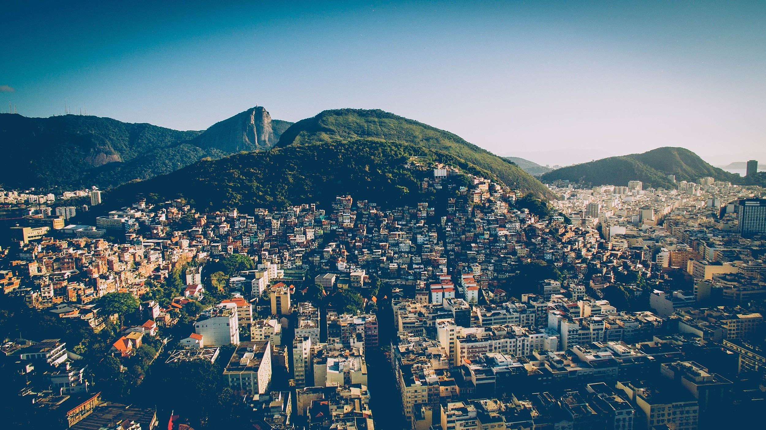 Aerial view of a densely populated favela on a mountainside in Rio de Janeiro HD Wallpaper