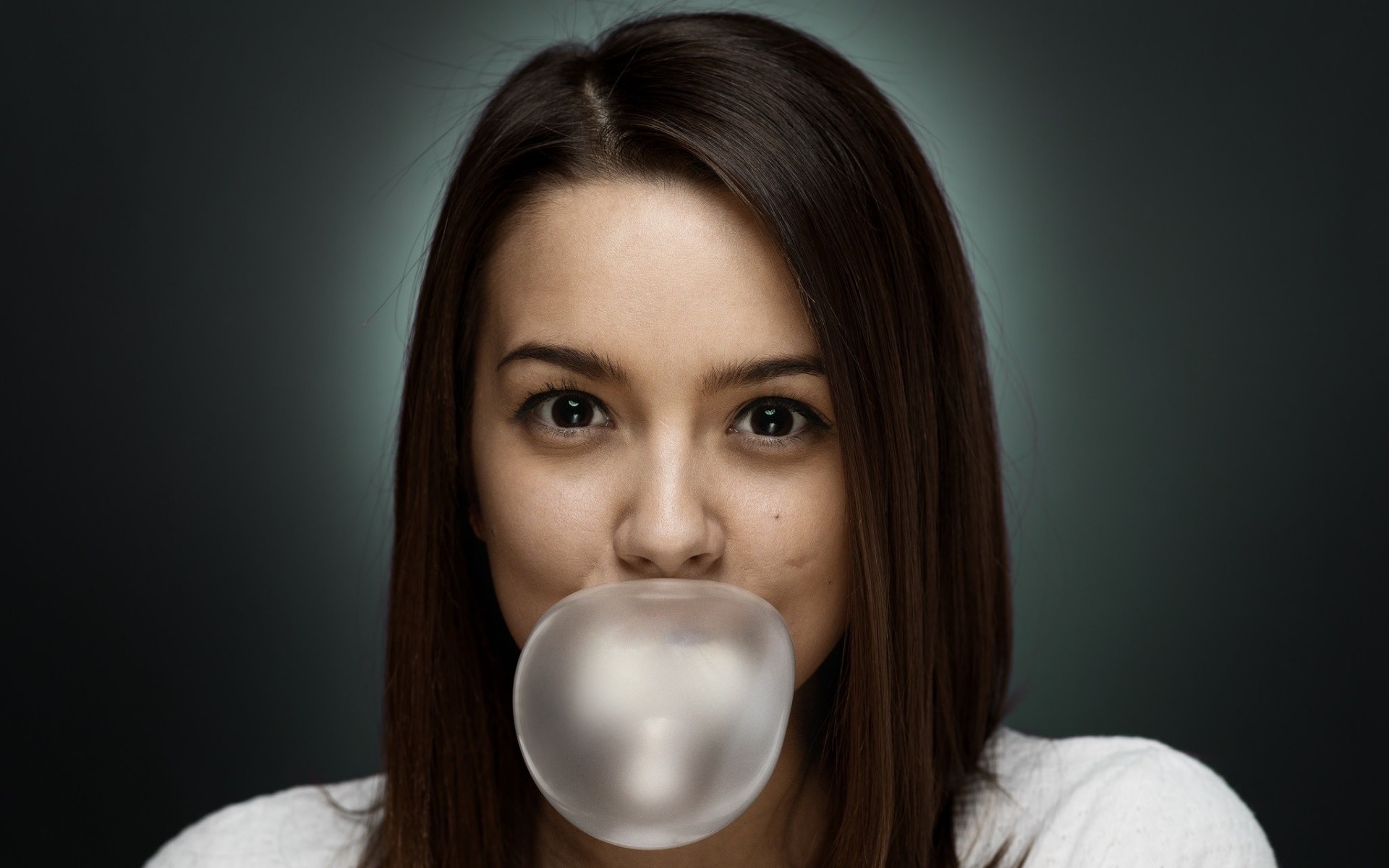 Woman blowing a large bubble gum bubble HD Wallpaper