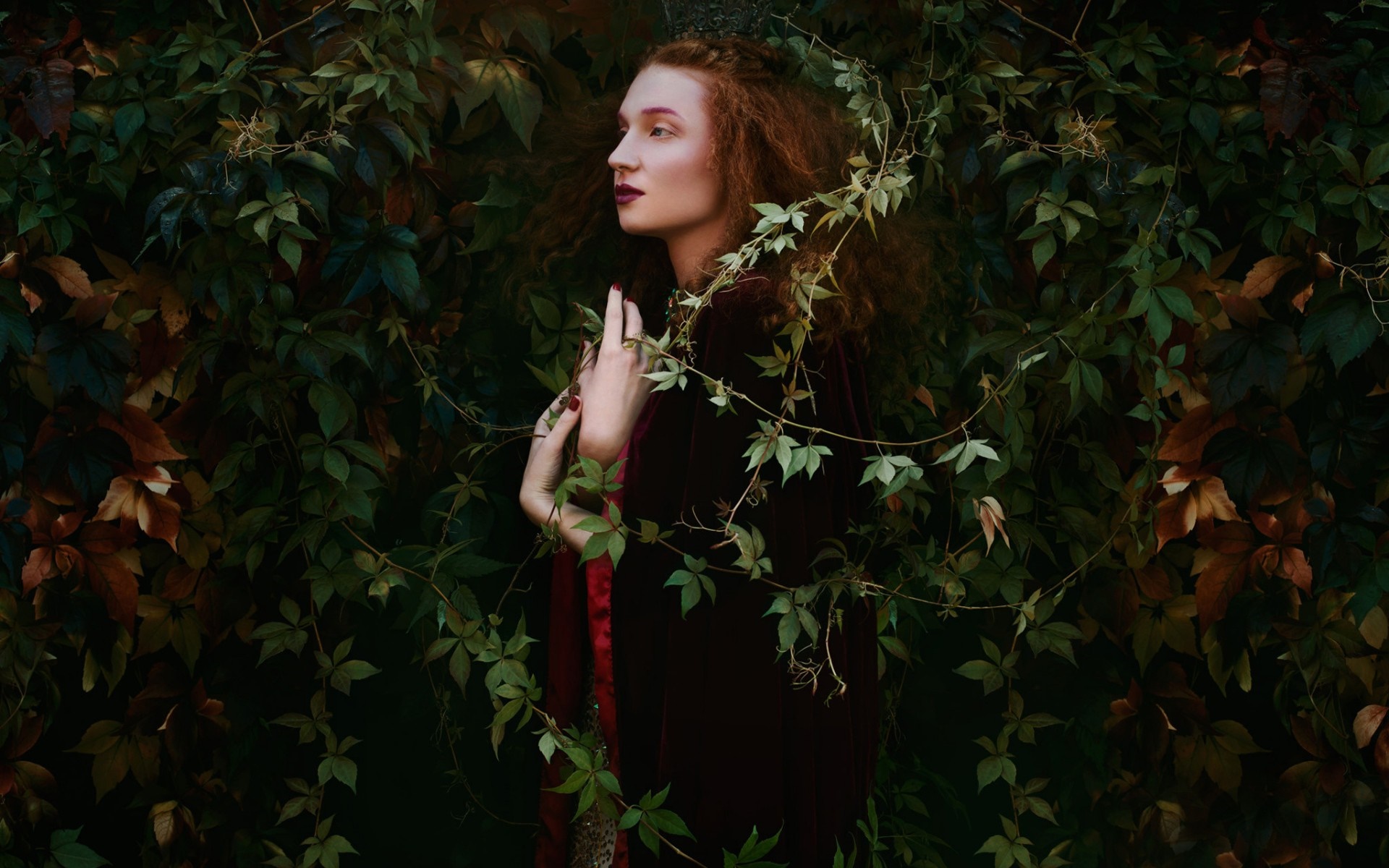 Woman with red hair in a dark forest surrounded by vines HD Wallpaper
