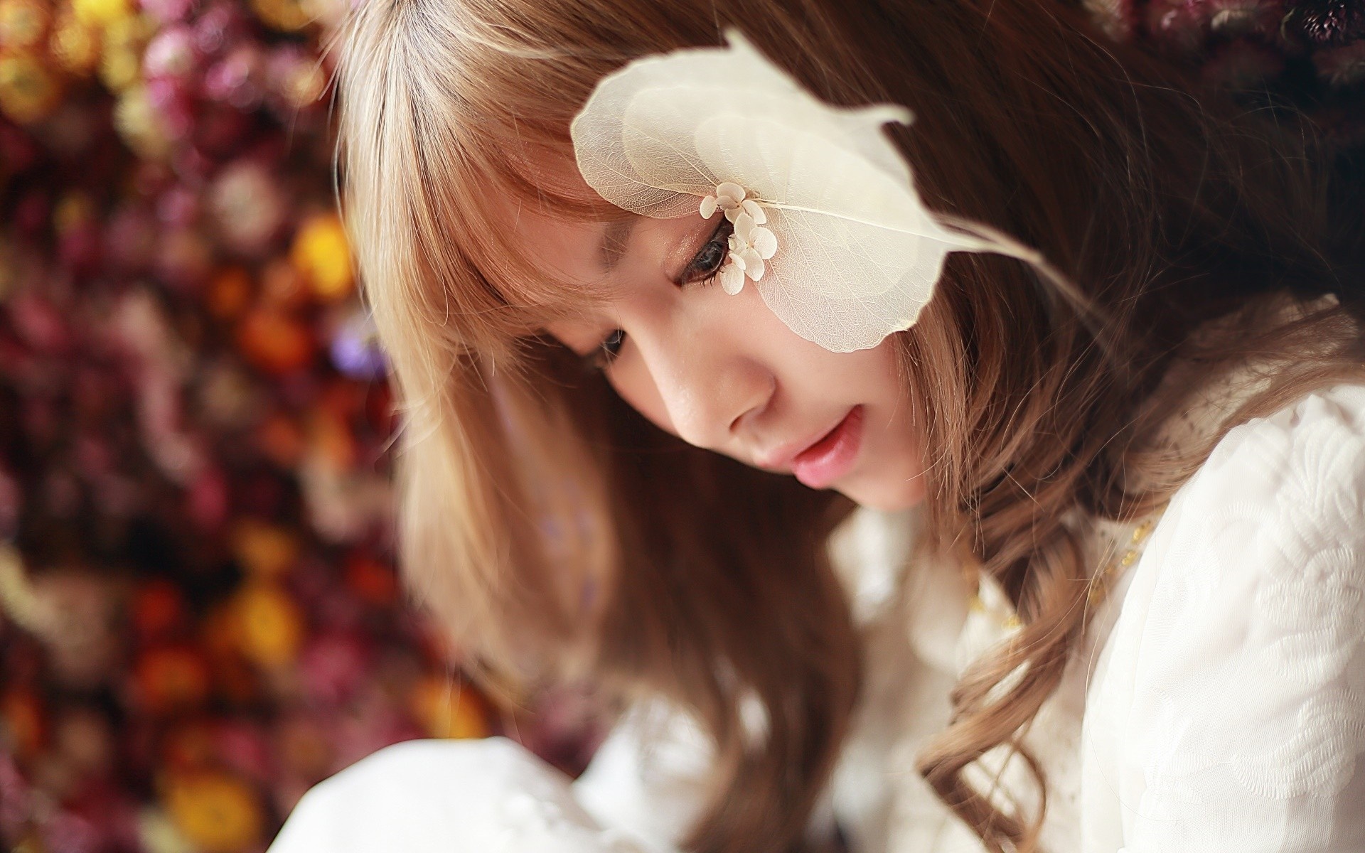 Close up portrait of a young woman with a flower accessory HD Wallpaper