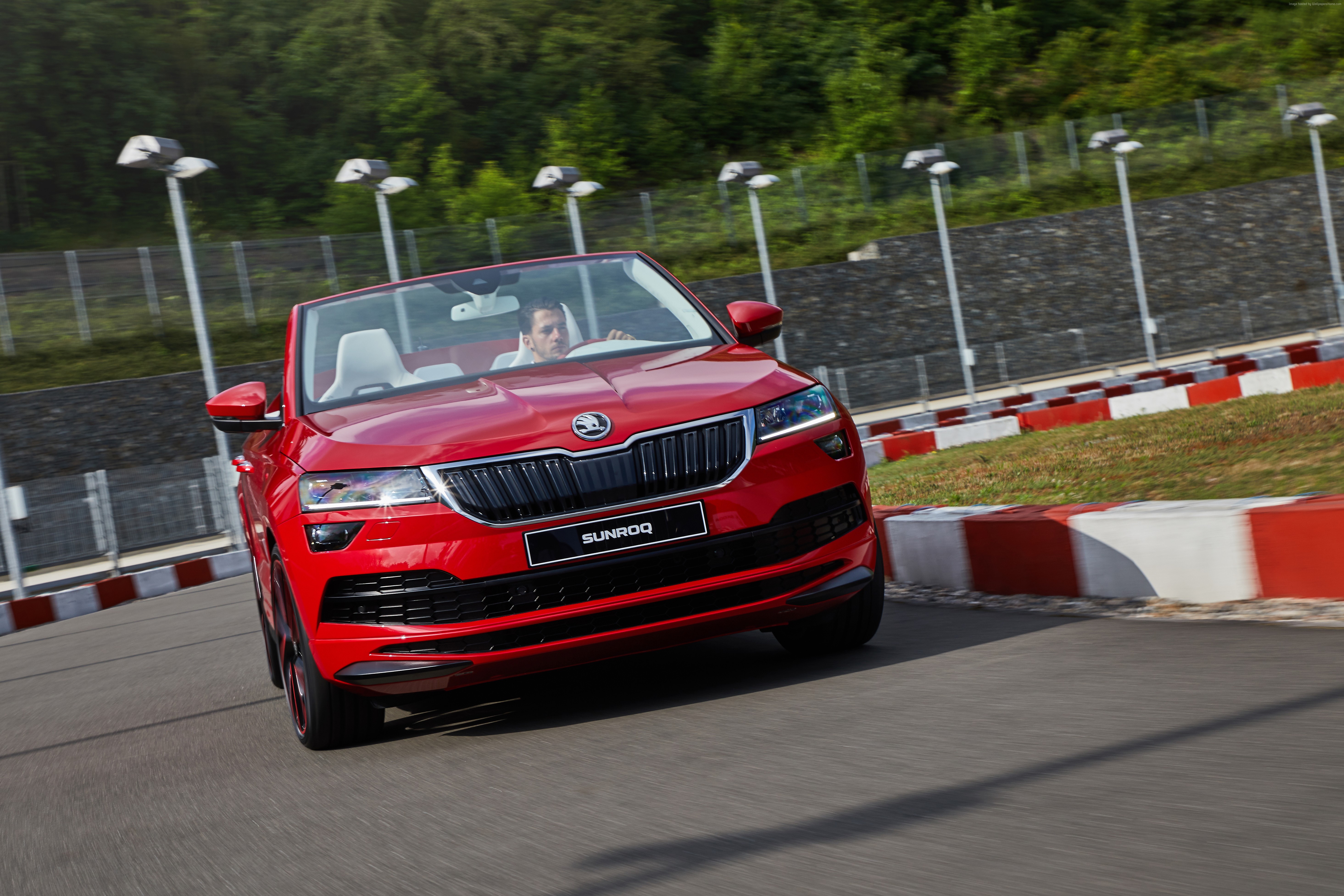 Red Skoda Sunroq Convertible driving on a race track HD Wallpaper