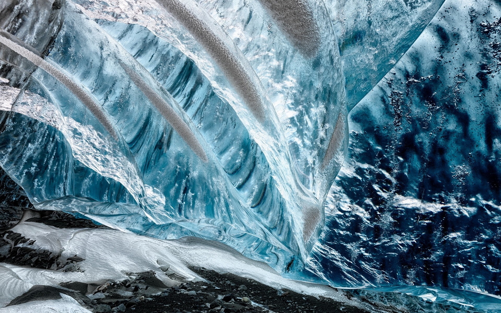 Inside a blue ice cave with frozen waterfall HD Wallpaper