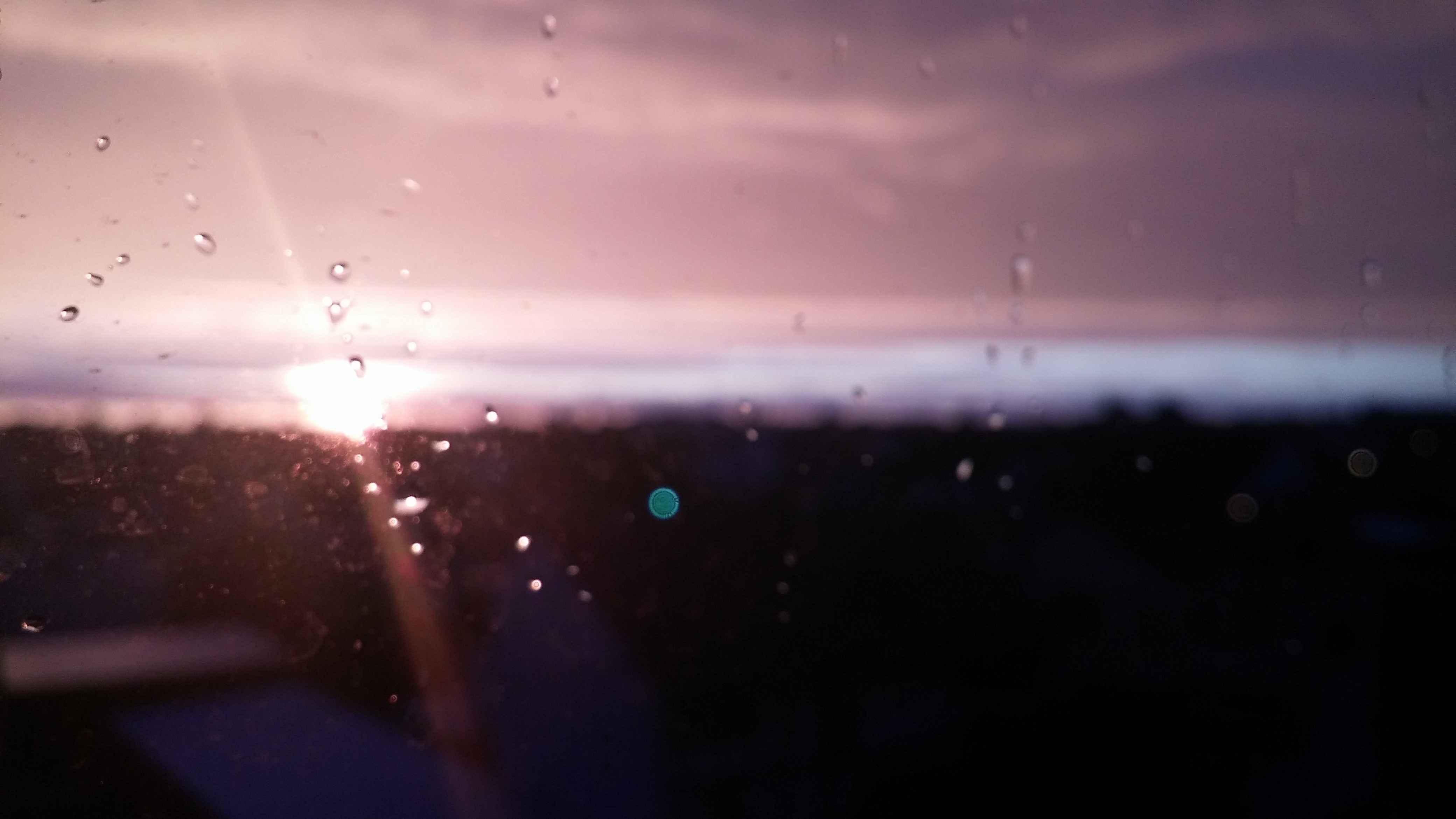 Sunset through a rainy window HD Wallpaper
