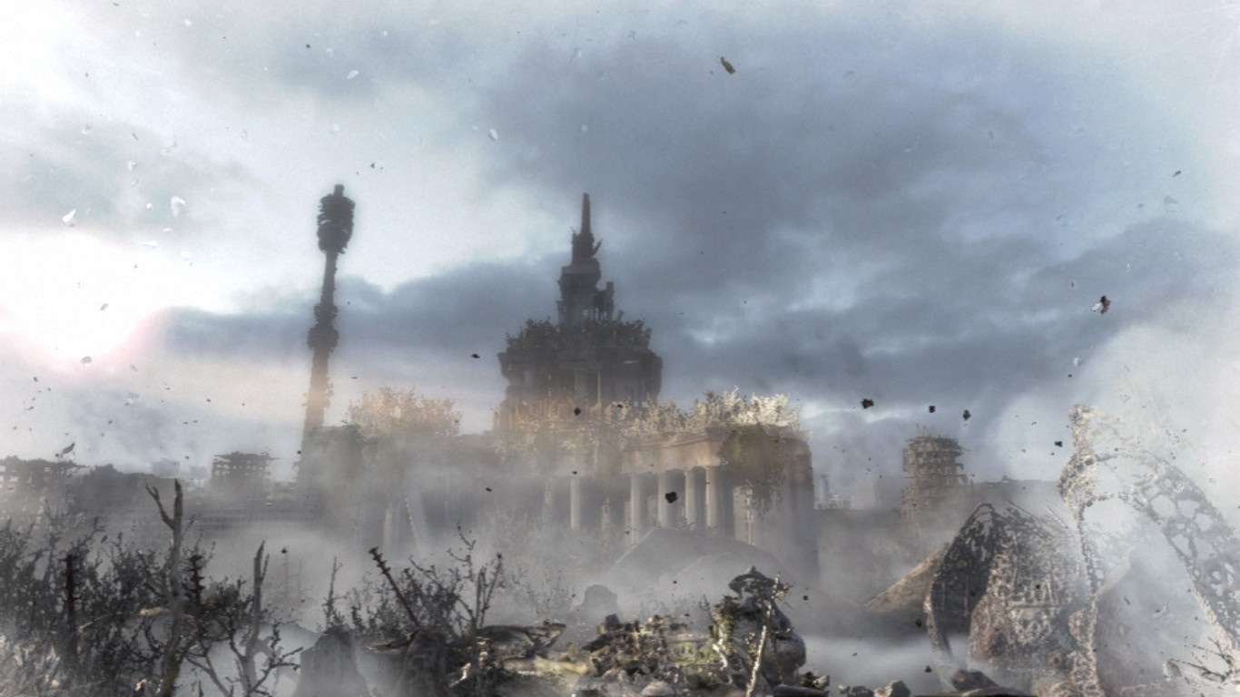 Post-apocalyptic city with a tall tower and ruined buildings HD Wallpaper