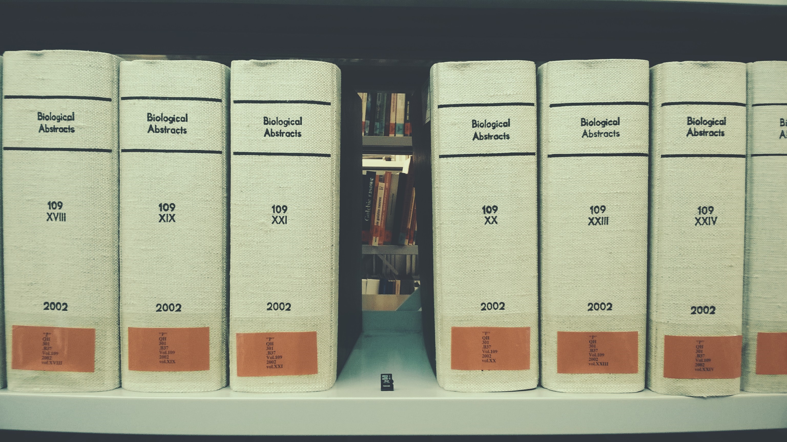 Biological Abstracts books on a shelf HD Wallpaper