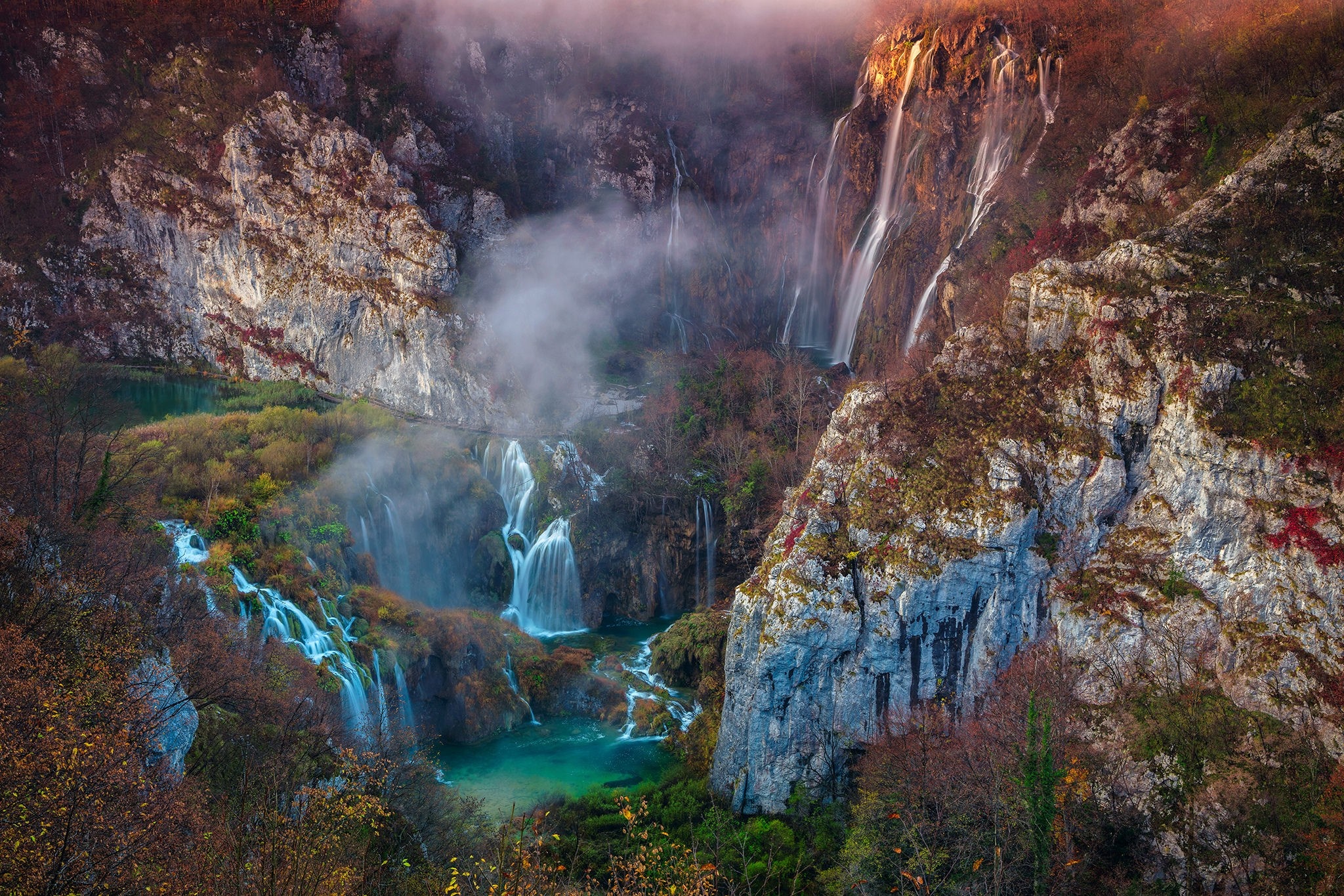 Autumn waterfall landscape with mist and rocky cliffs HD Wallpaper