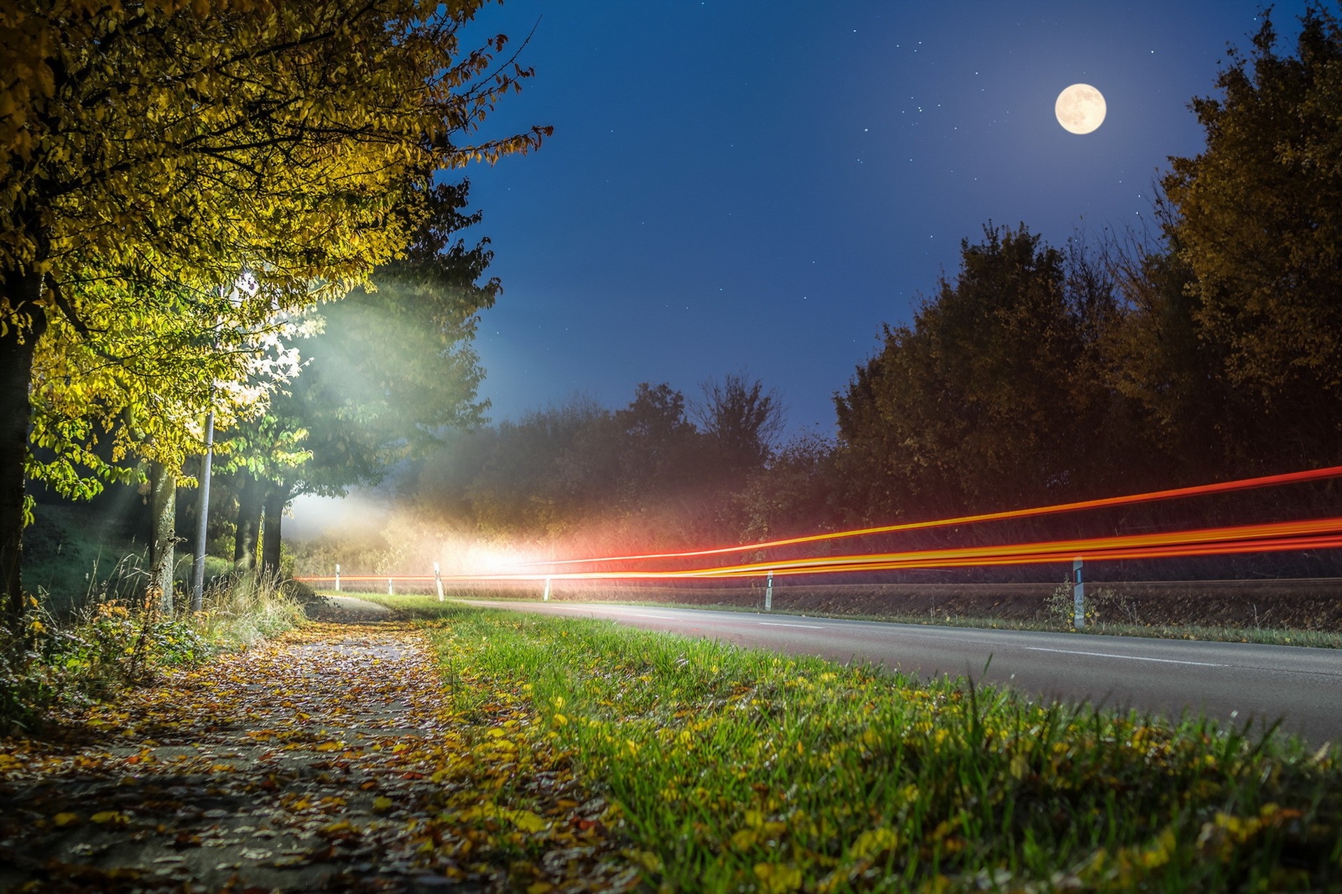 Night road with light trails and full moon HD Wallpaper