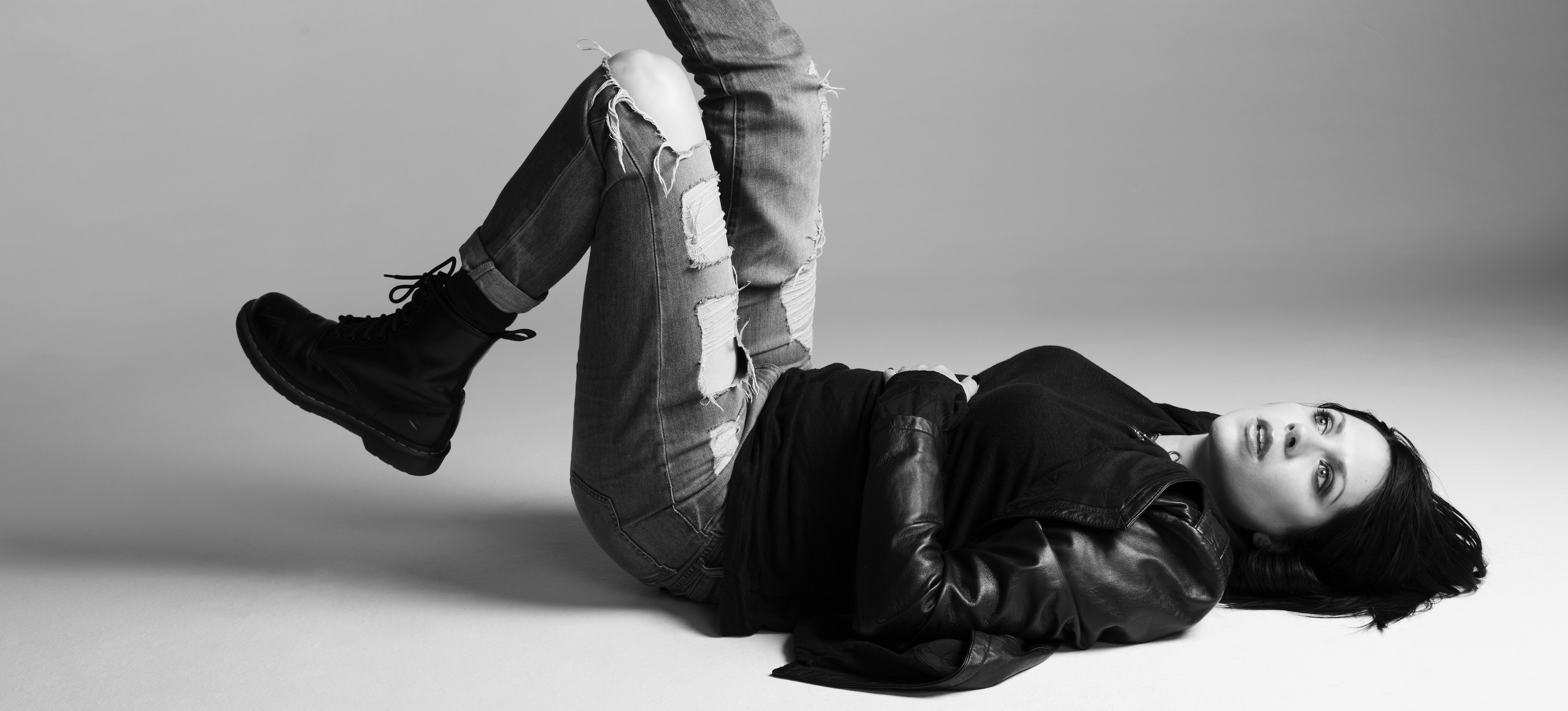 K. Flay lying on the floor in ripped jeans and leather jacket HD Wallpaper