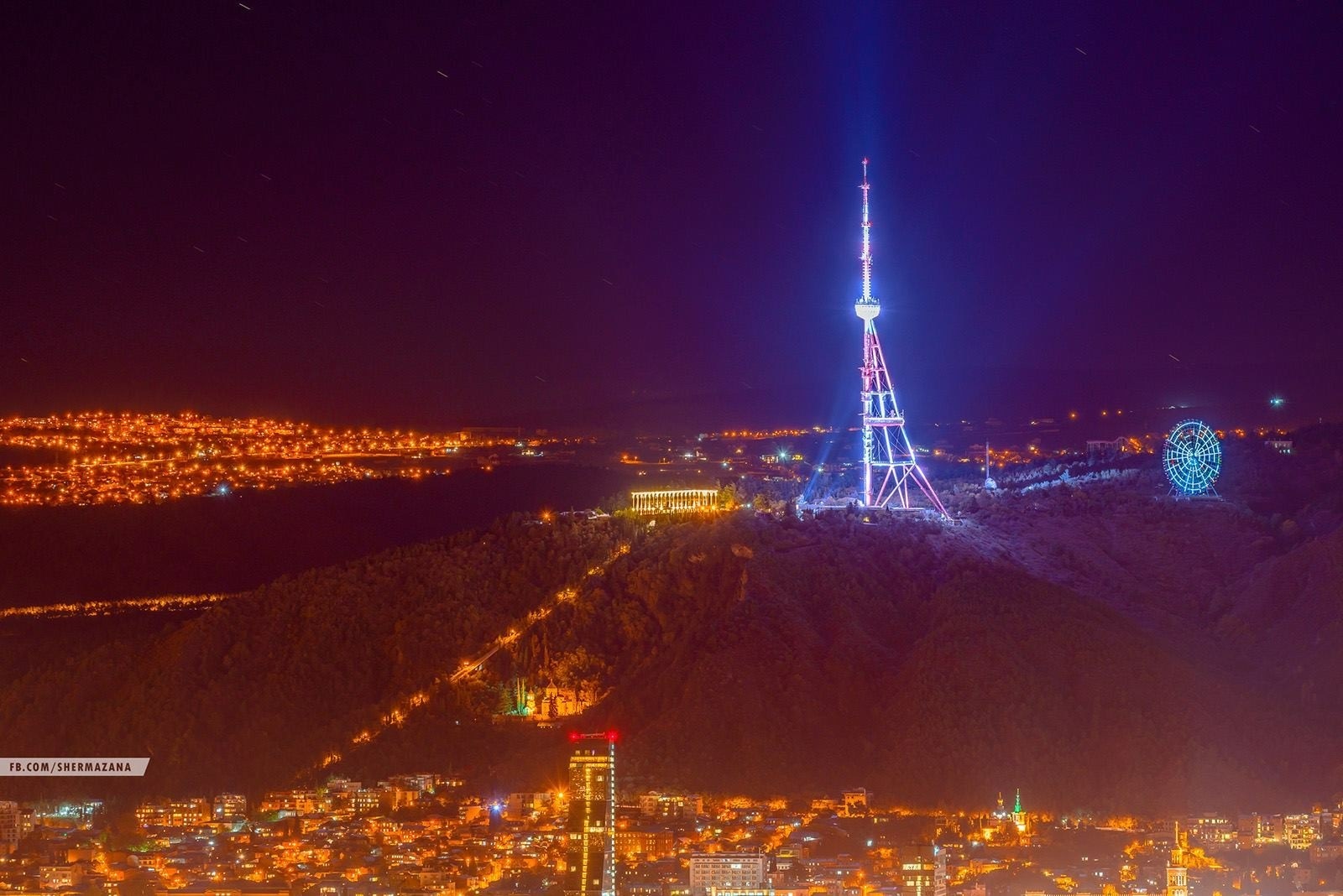 Tbilisi cityscape at night with TV tower and Ferris wheel HD Wallpaper