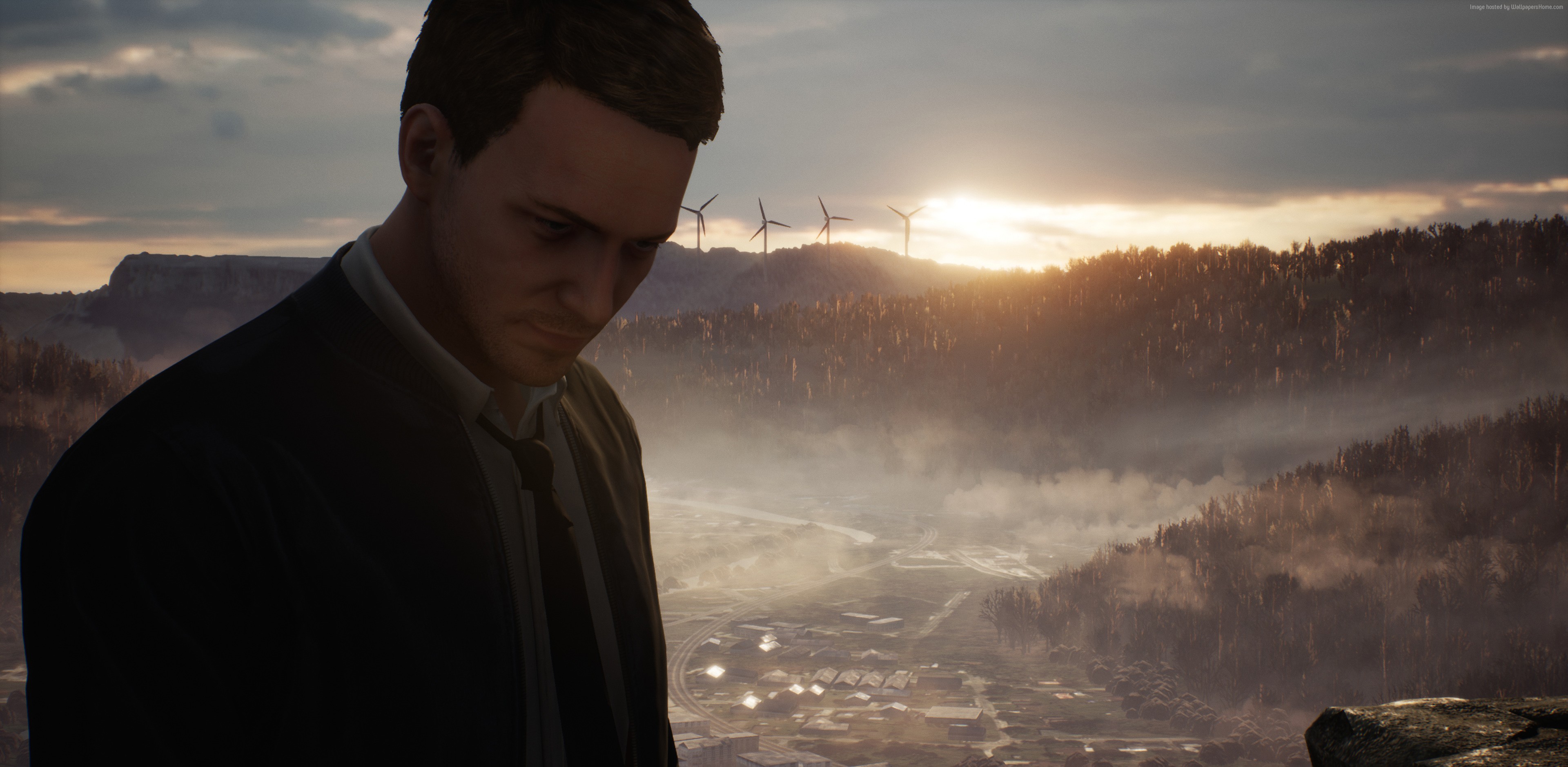 Man in suit overlooking valley with wind turbines HD Wallpaper