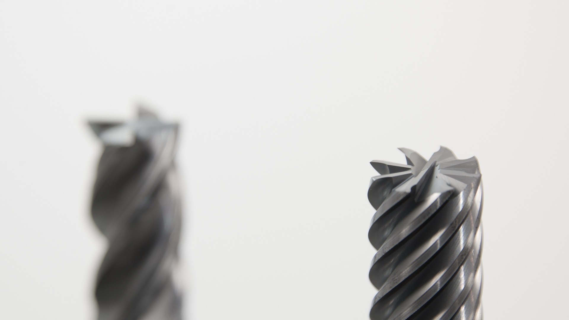 Two metal milling tools with spiral flutes HD Wallpaper