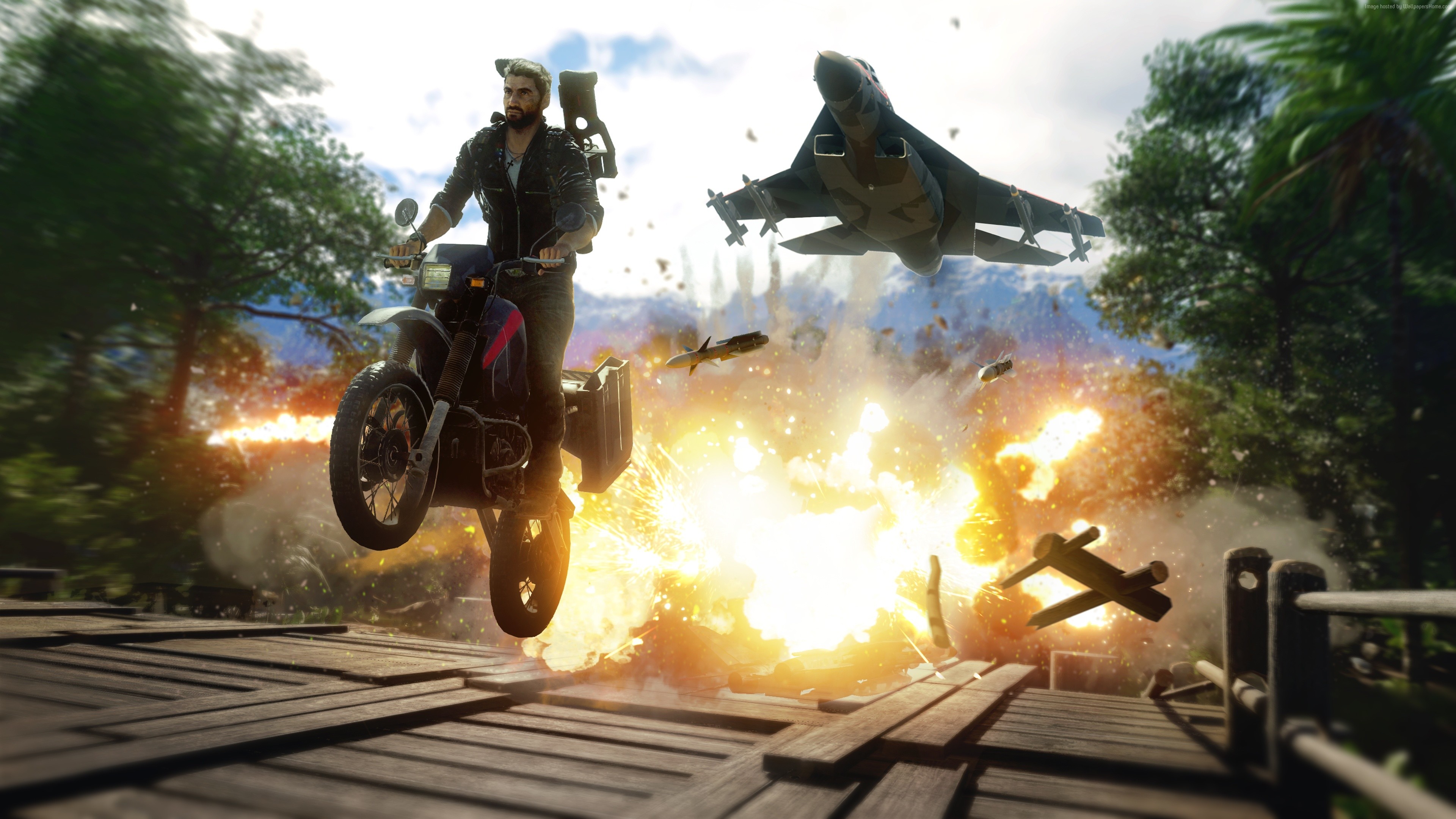 Rico Rodriguez from Just Cause 4 on a motorcycle during an explosion HD Wallpaper