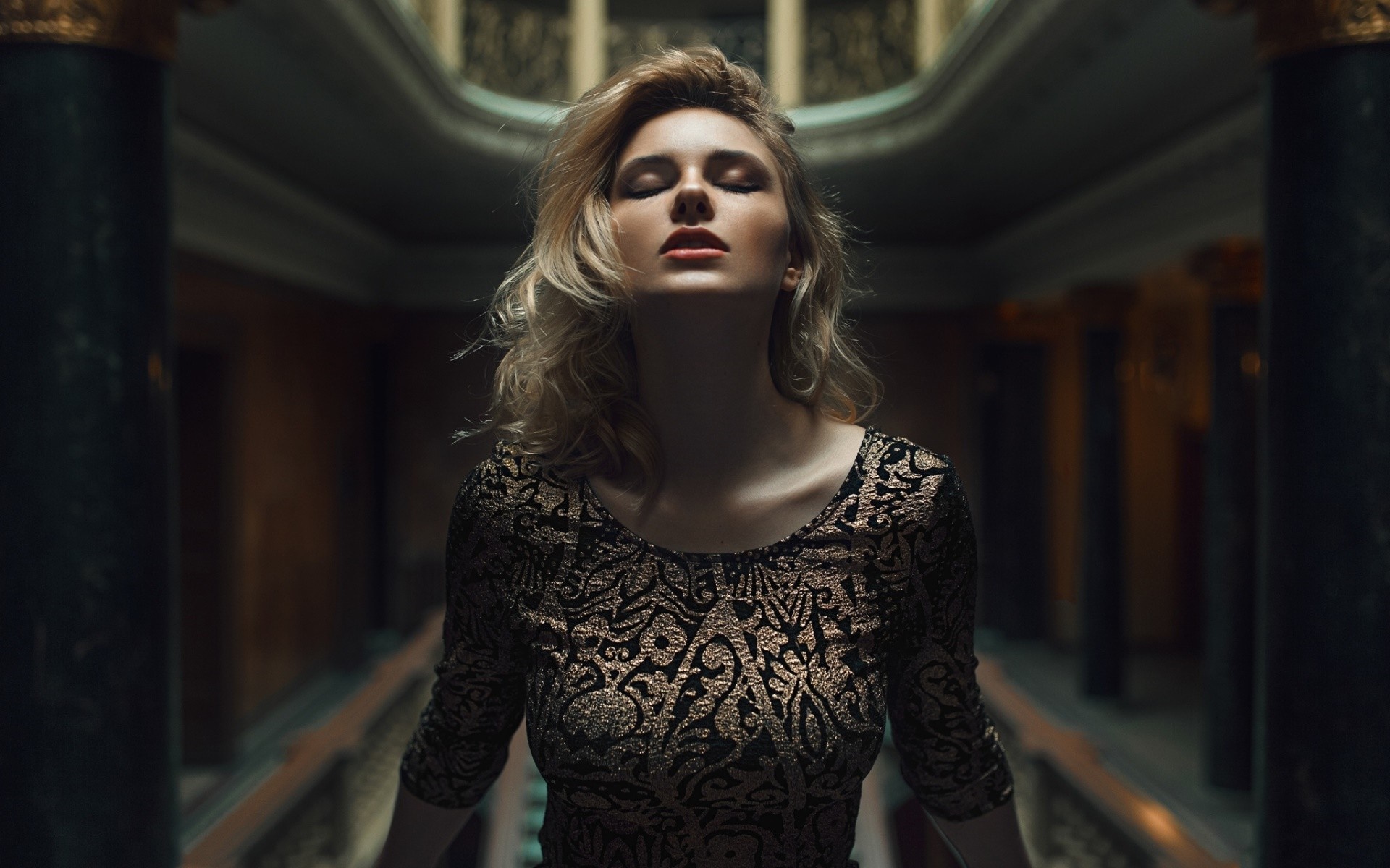 Woman with closed eyes in a patterned dress HD Wallpaper