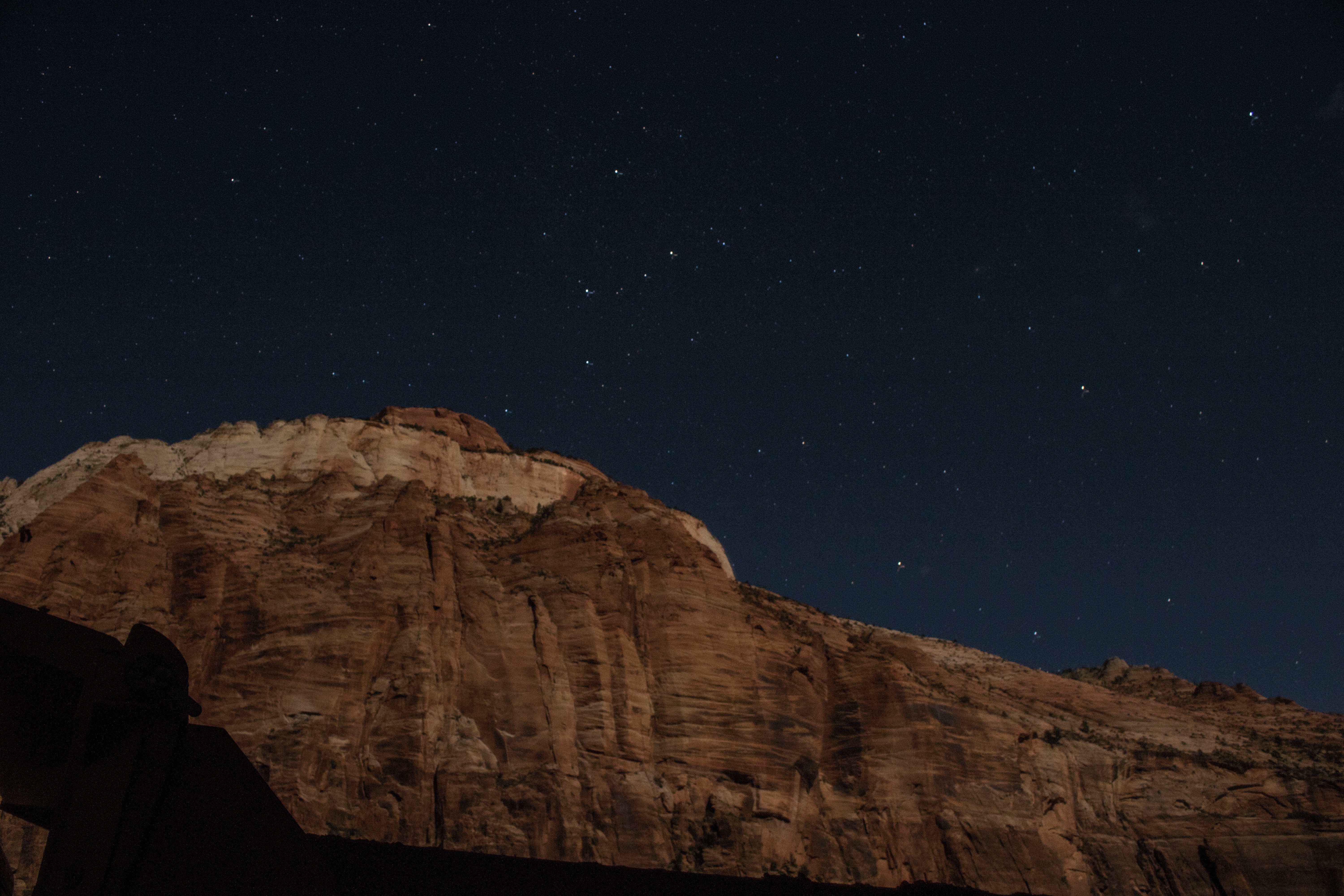 Mountain under a starry night sky HD Wallpaper