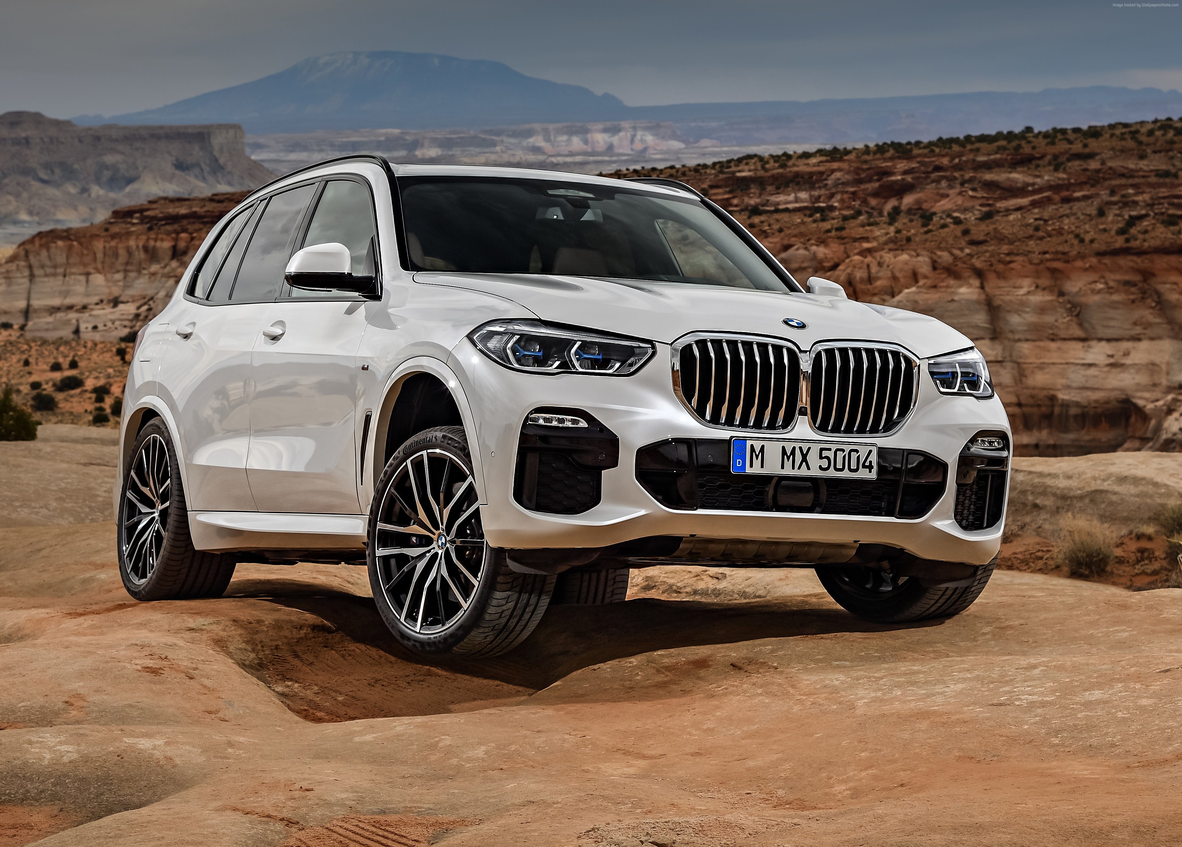 White BMW X5 SUV in a desert landscape HD Wallpaper