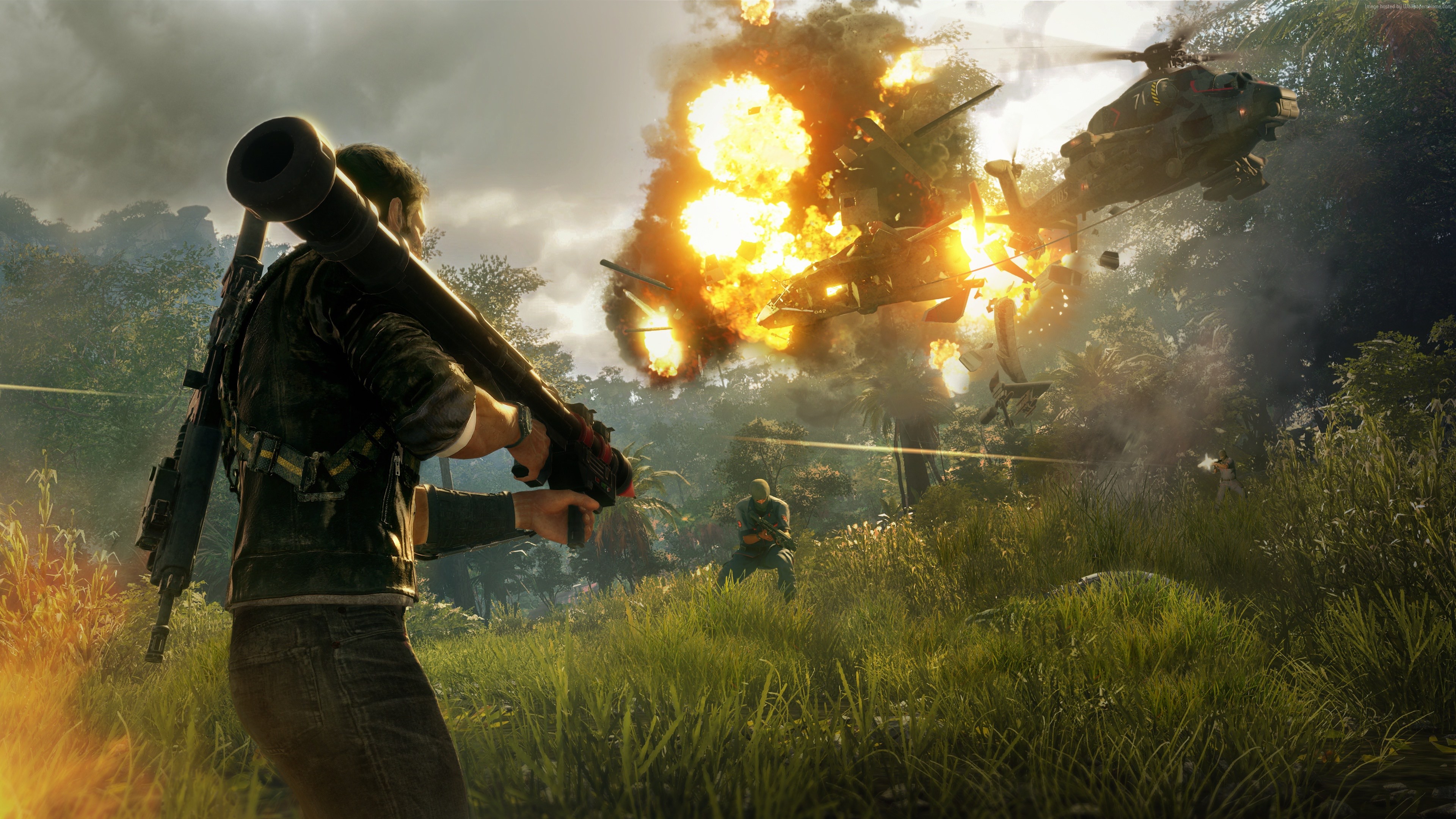 Rico Rodriguez from Just Cause 4 firing a rocket launcher at helicopters HD Wallpaper