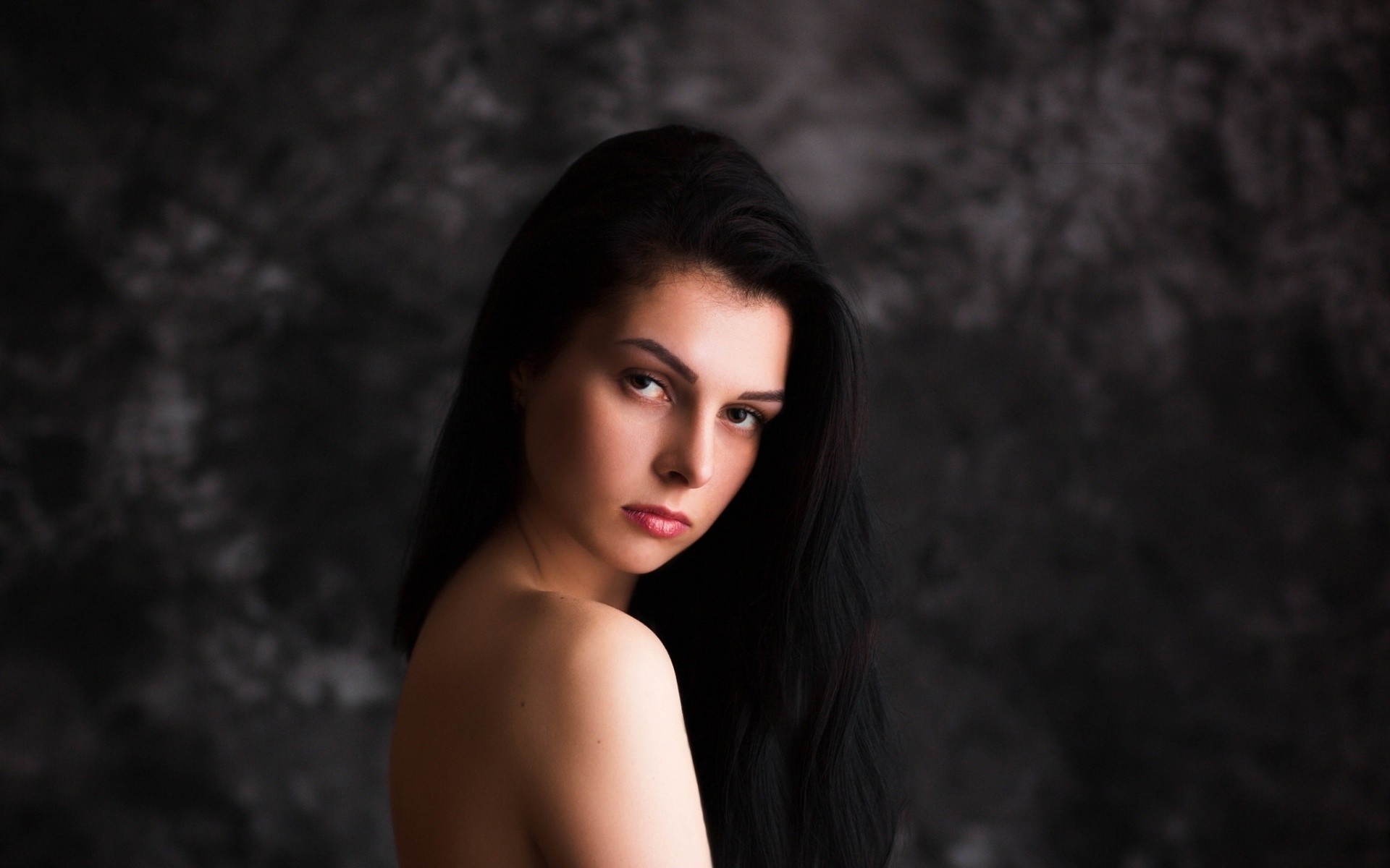 Woman with long black hair posing for a portrait HD Wallpaper