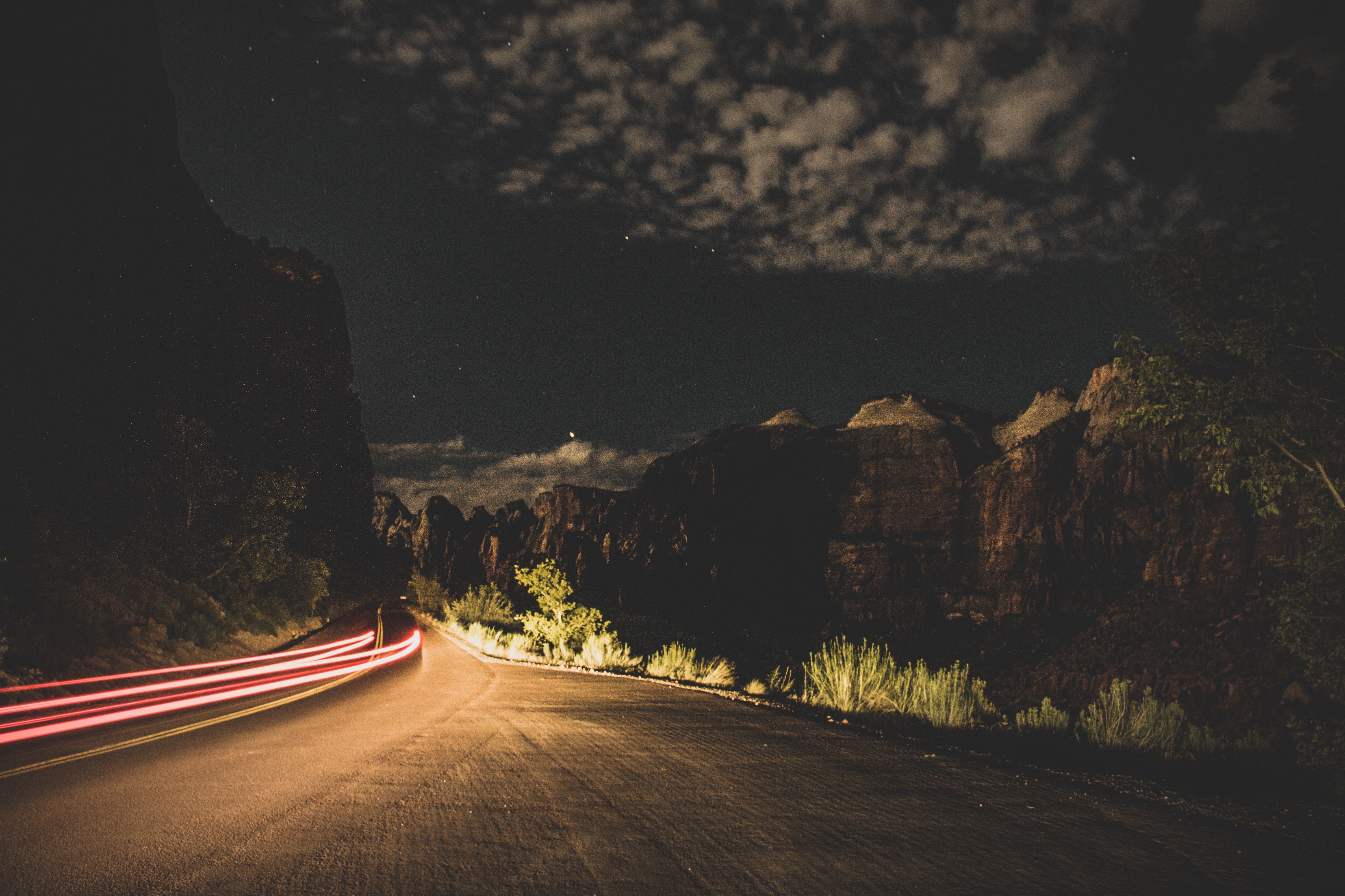 Night road with light trails and mountains HD Wallpaper
