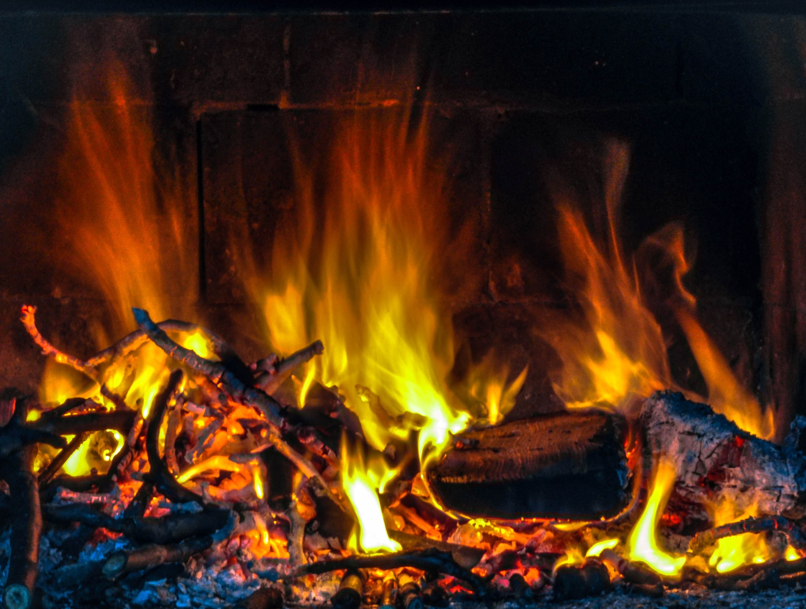 Fire burning in a fireplace HD Wallpaper