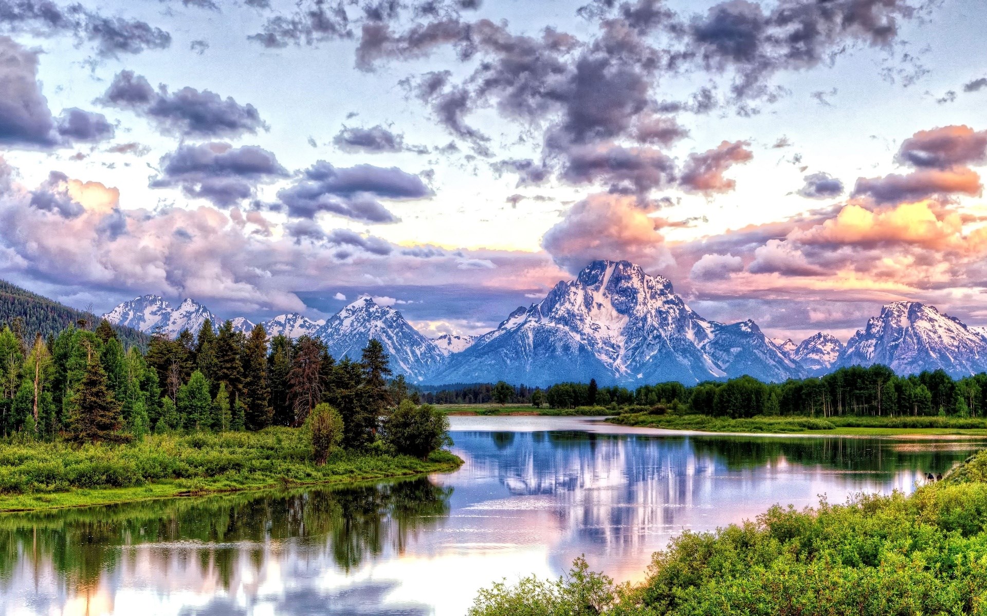 Snow-capped mountains reflected in a calm lake at sunset HD Wallpaper