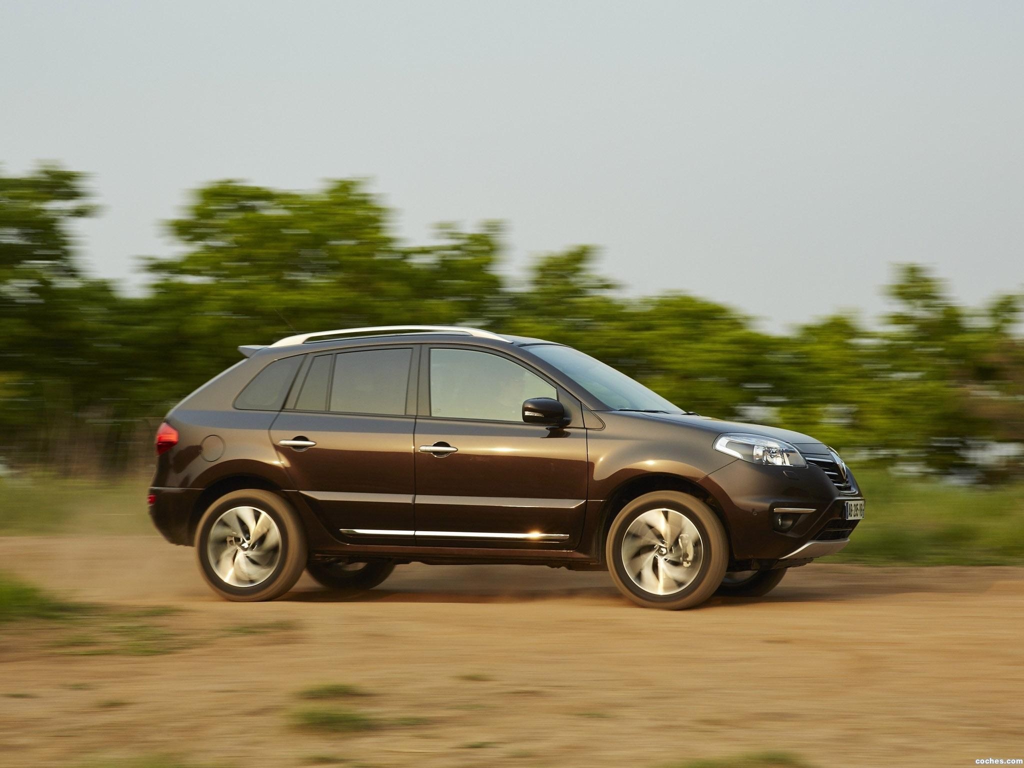 Brown Renault Koleos driving on a dirt road HD Wallpaper