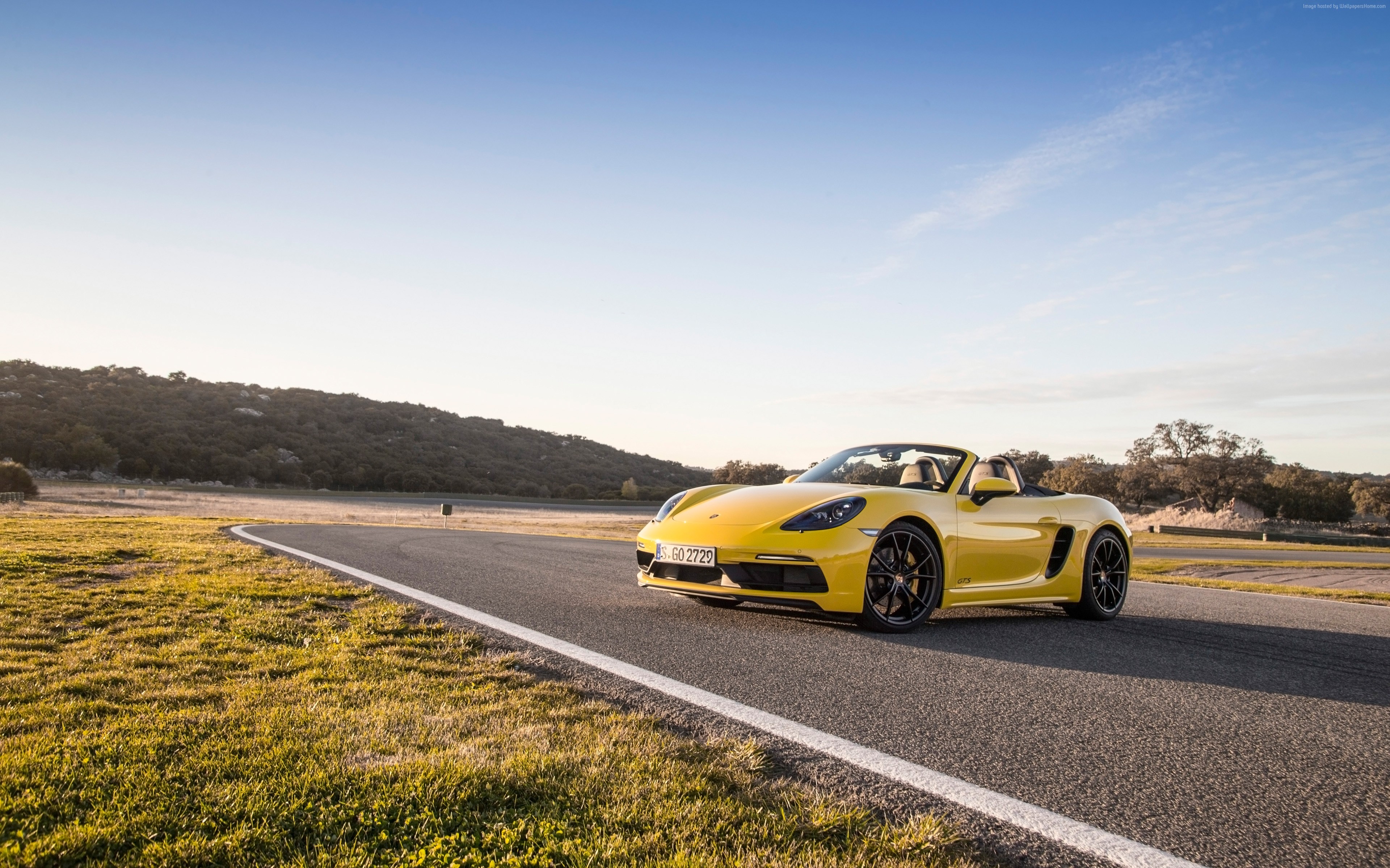 Yellow Porsche 718 Boxster GTS on a Racetrack HD Wallpaper