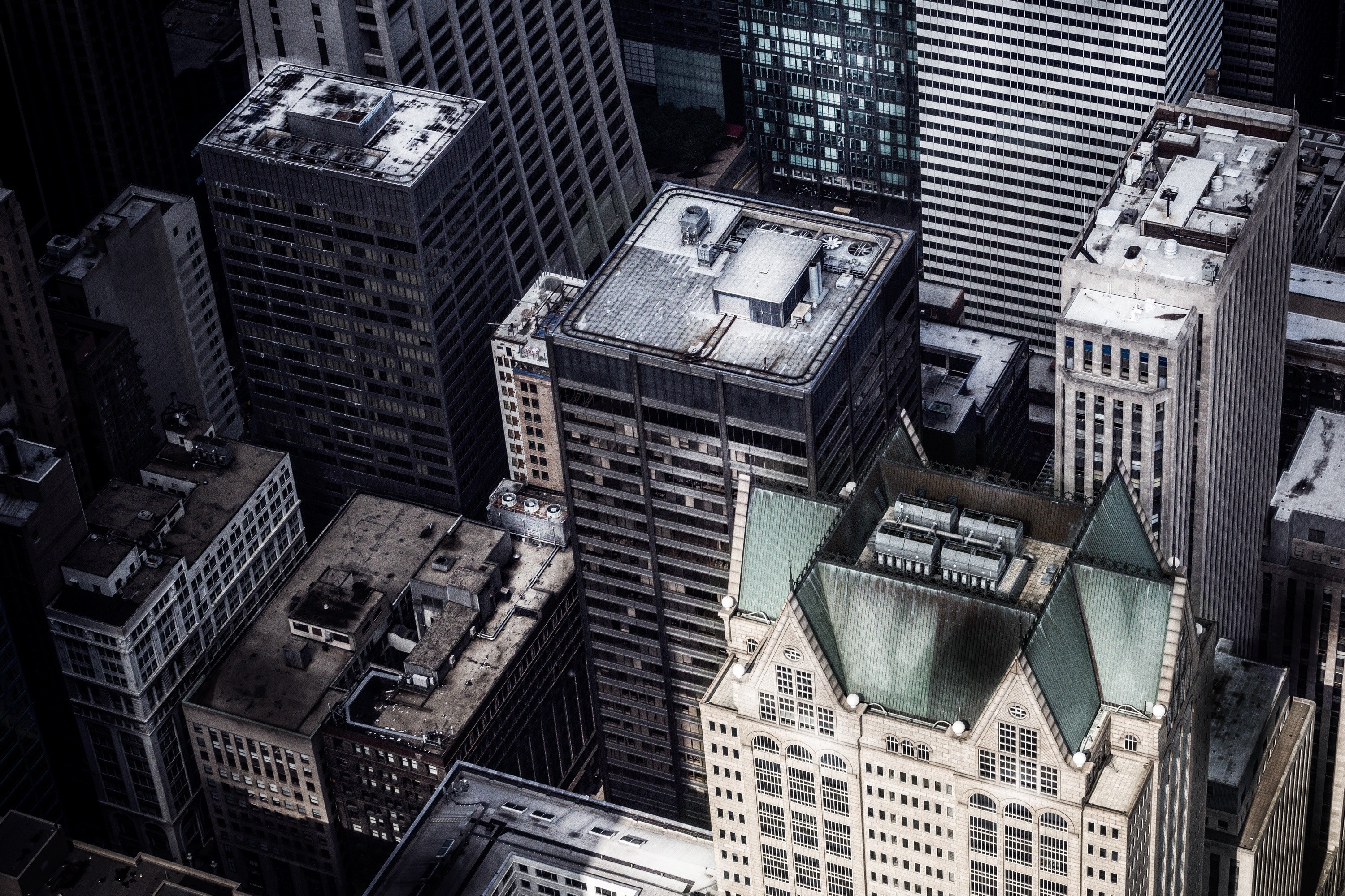Aerial view of a dense urban cityscape with skyscrapers HD Wallpaper