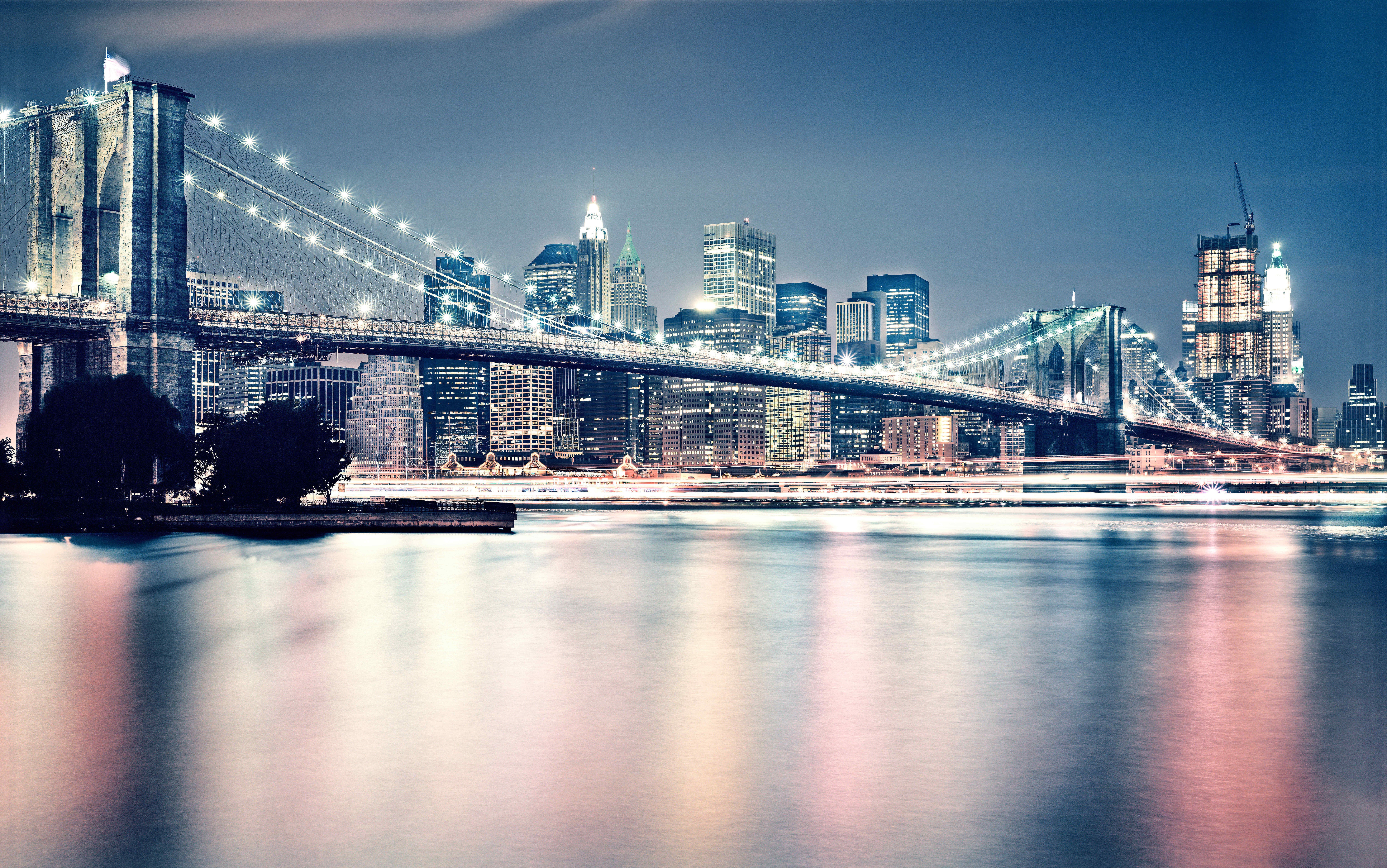 Brooklyn Bridge at night with New York City skyline HD Wallpaper