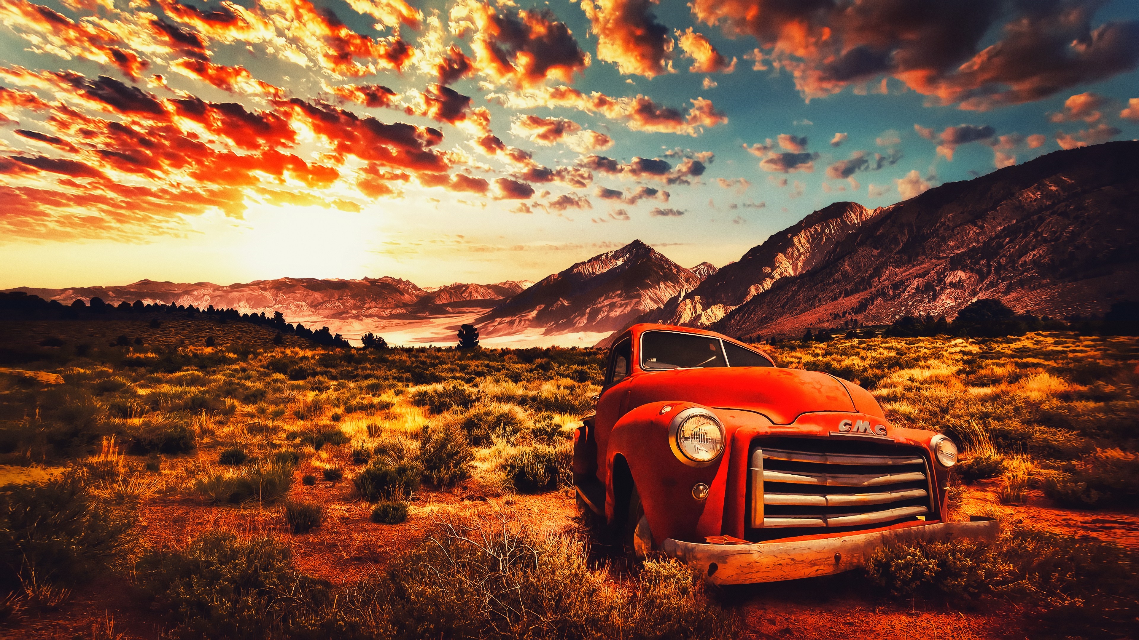 Vintage GMC truck in a desert landscape at sunset HD Wallpaper