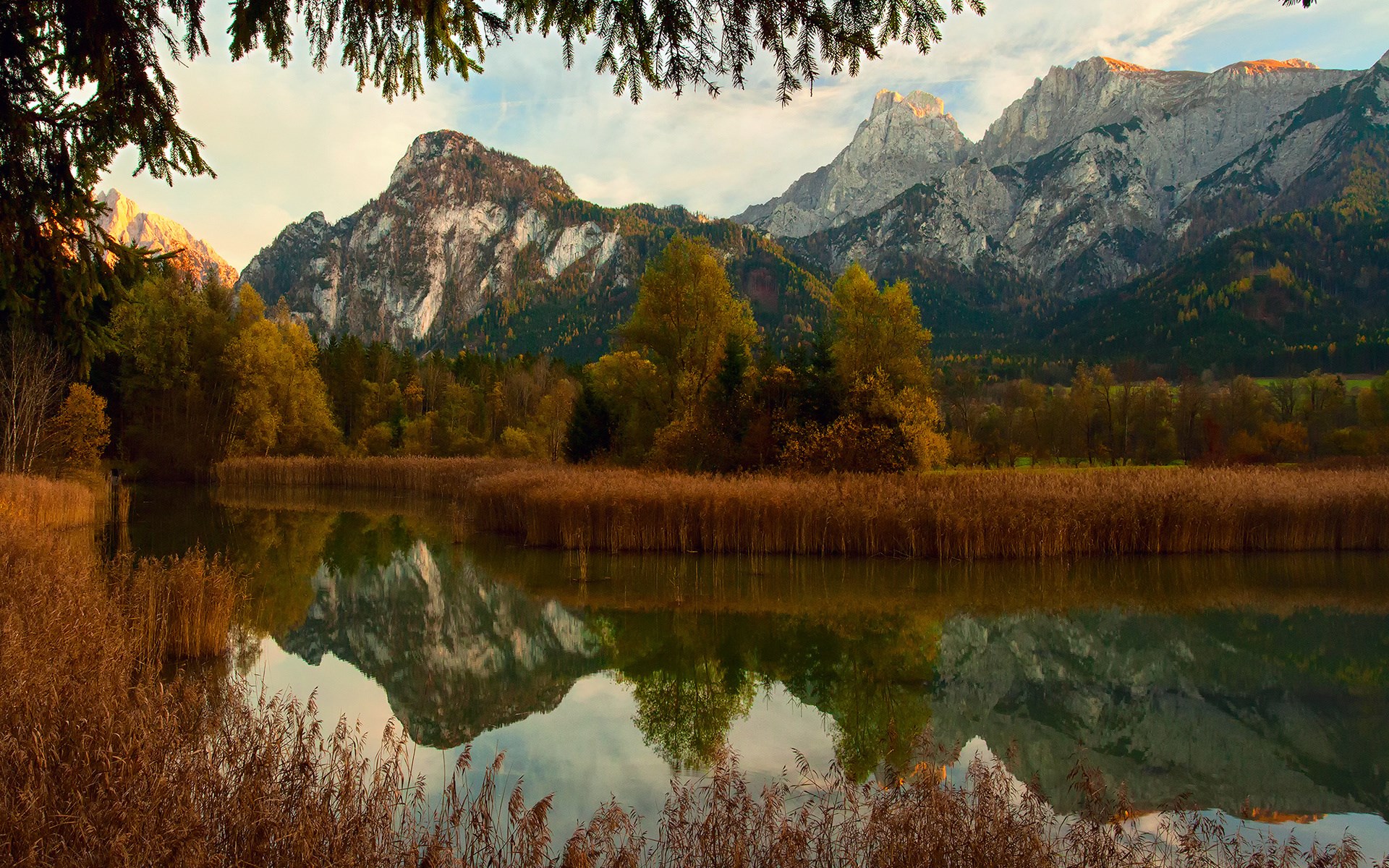 Autumn lake reflecting mountains and trees HD Wallpaper