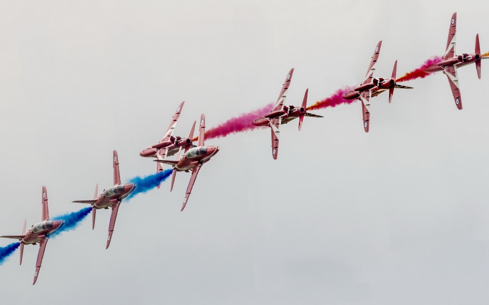 Red Arrows aerobatic team flying in formation HD Wallpaper