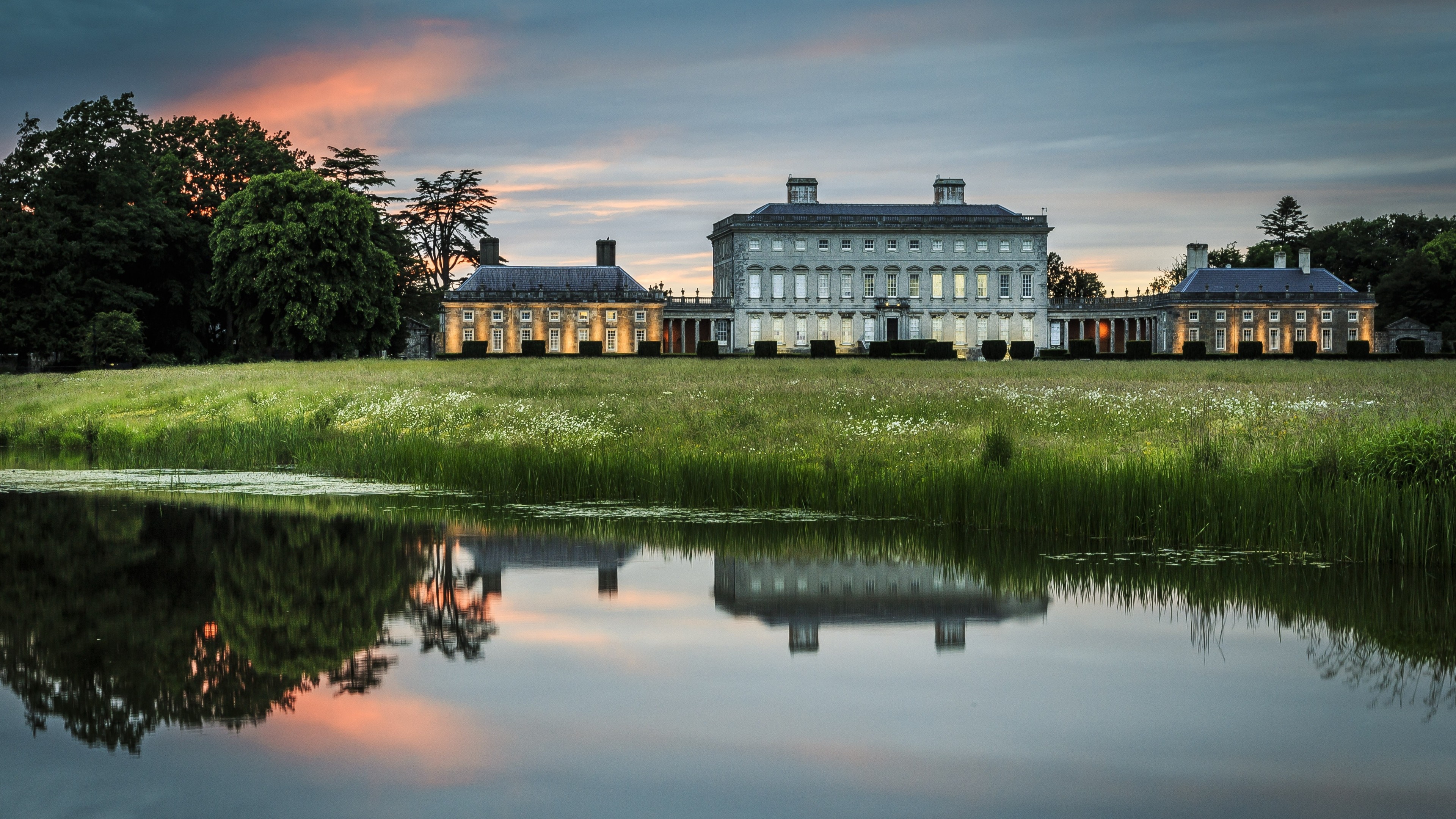 Mansion estate with reflection at sunset HD Wallpaper
