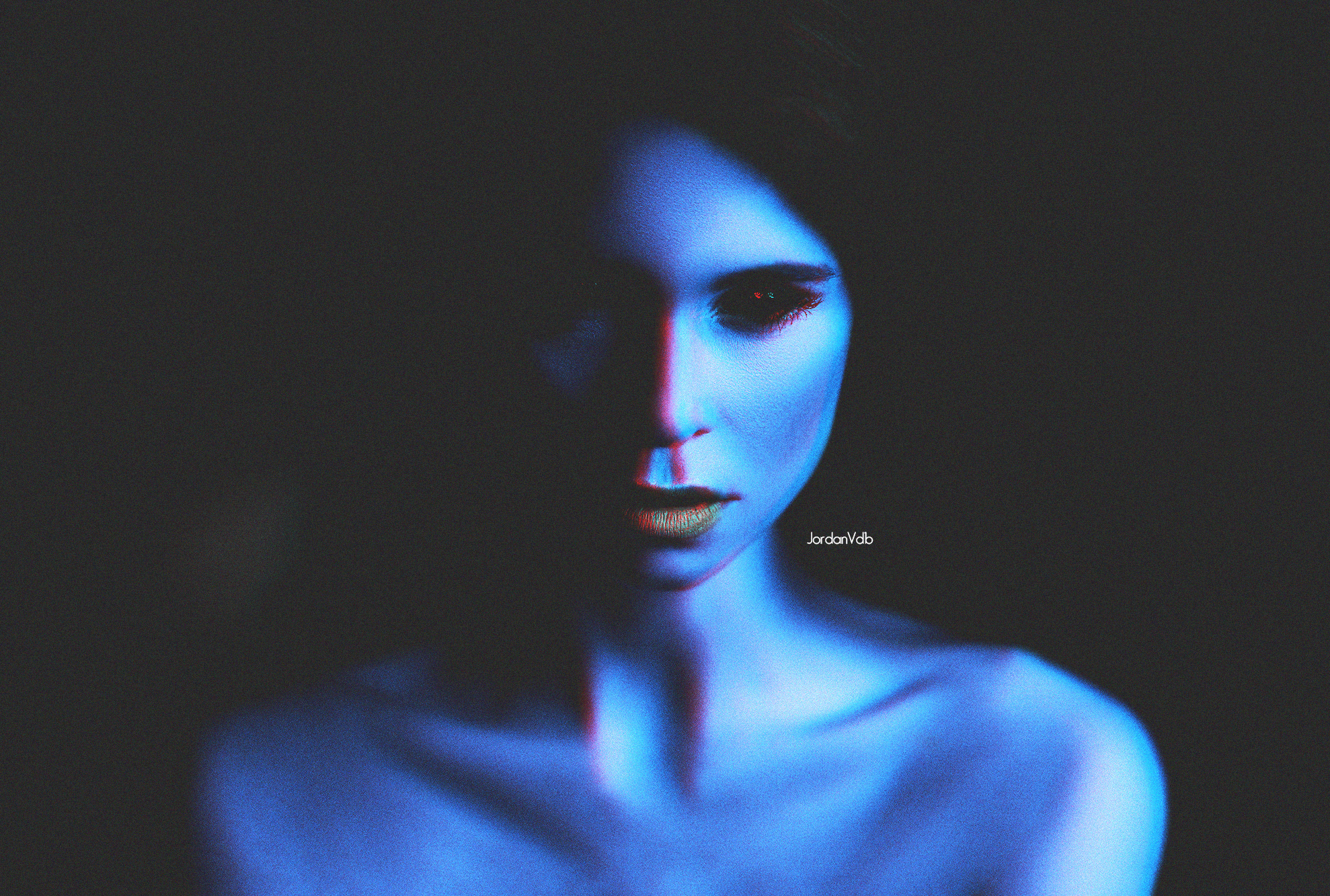 Woman with blue skin and red eyes in darkness HD Wallpaper